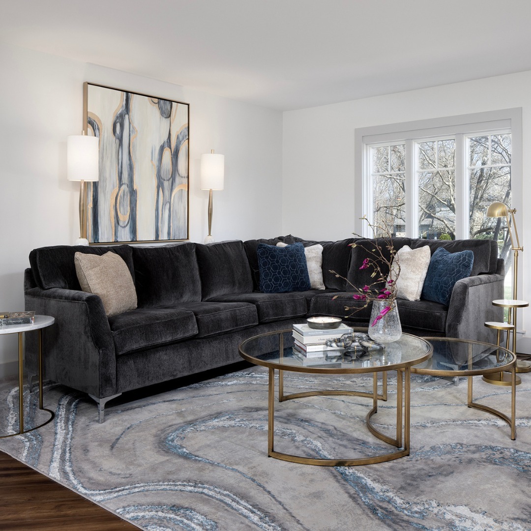 27. the Crimson Velvet Sofa with Geometric Wall Art and Potted Ferns