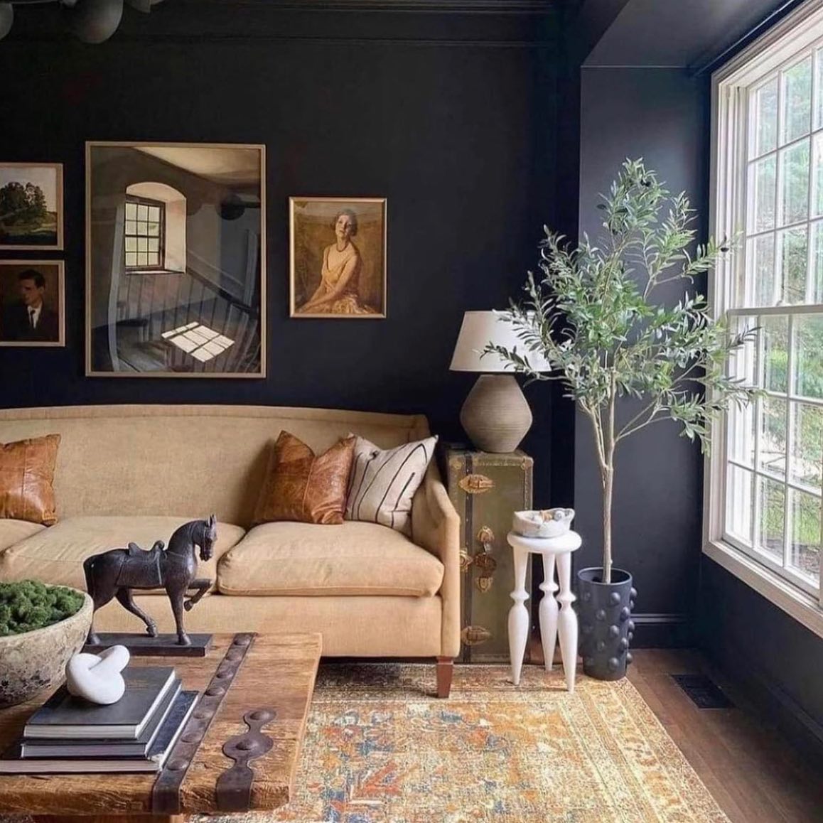 43. Warm Amber Glow: a Living Room with a Sunlit Vintage Bookshelf and Cozy Knitted Throws