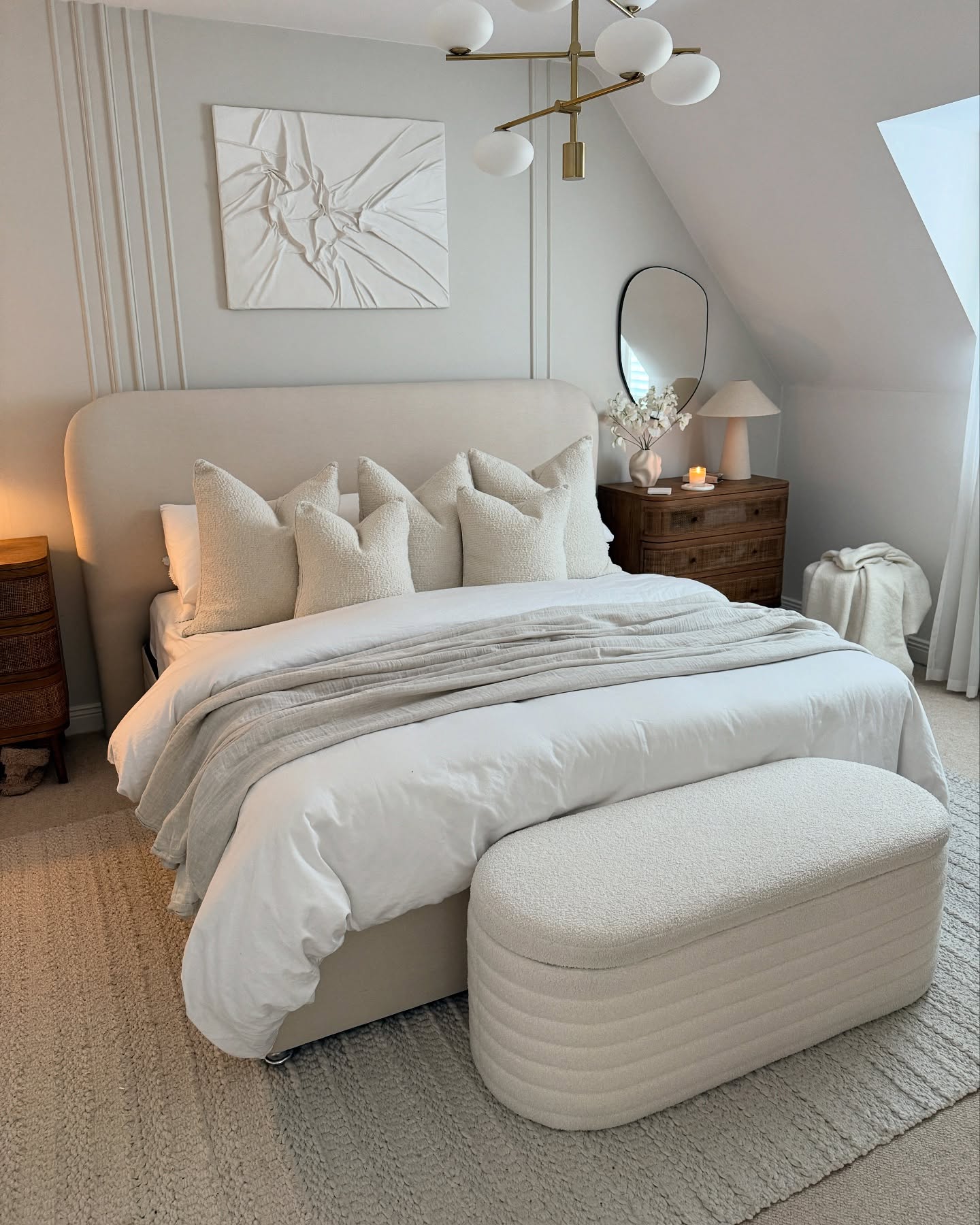 24. Moonlit Serenity: a Bedroom with Soft Beige Walls and a Crescent Moon Wall Art