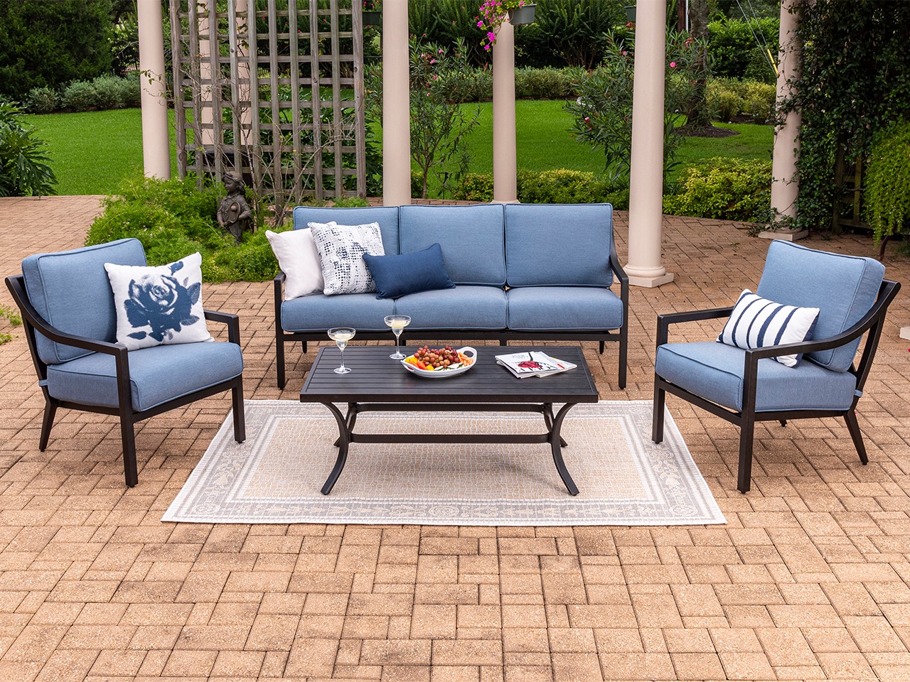 18. the Mosaic Tile Coffee Table with Wicker Armchairs and a Lemon Tree Accent