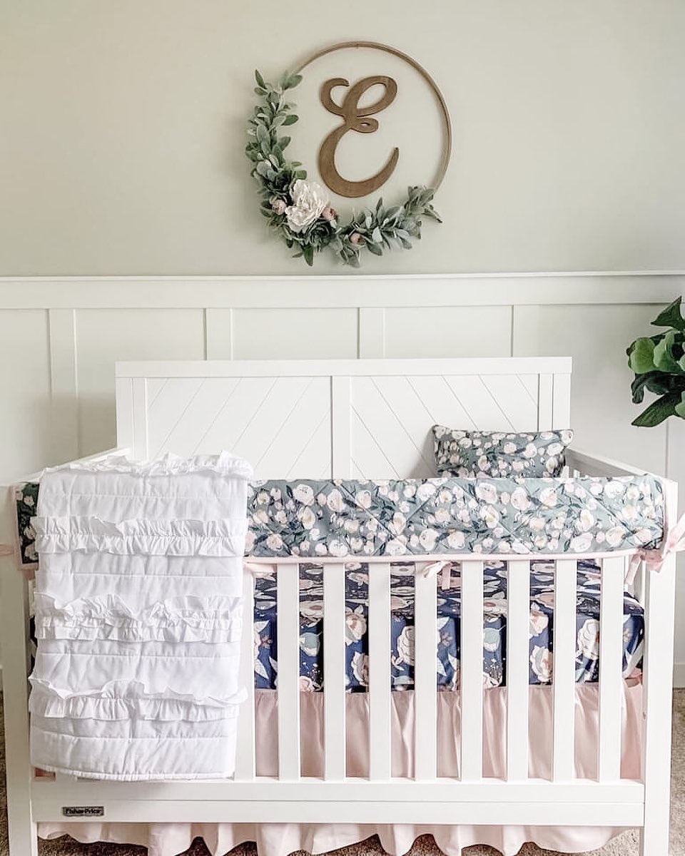 13. Sage Green Canopy Cradling a Celestial Mobile Above a Weathered Wood Crib