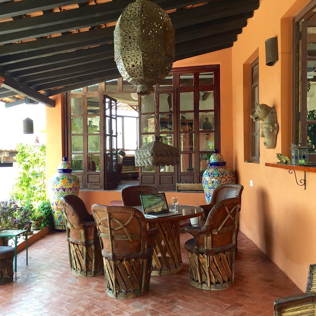 17. Sun-drenched Terracotta Tiles and Cactus Shadows Patio Design