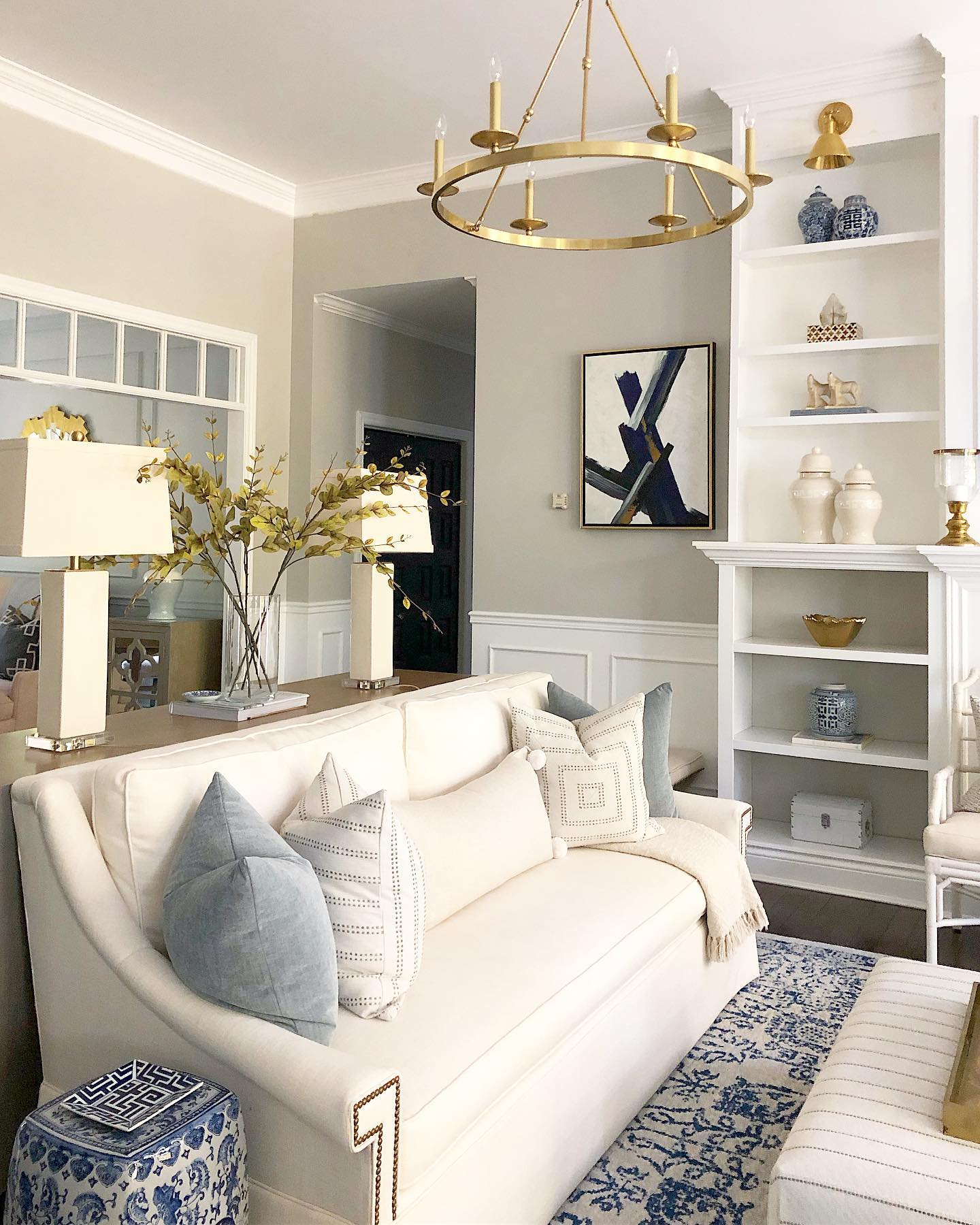 31. Cozy Living Room with a Sunlit Vintage Armchair and Macrame Wall Art