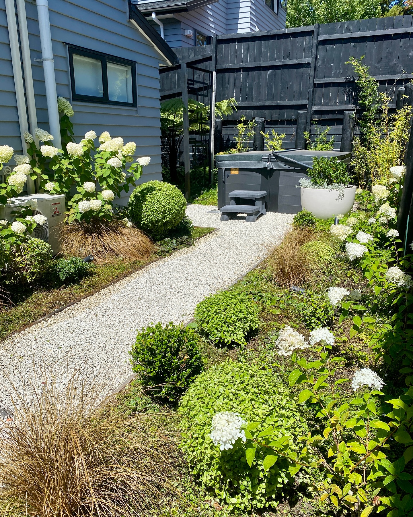 19. Whimsical Whirl Of White Petunias and Lavender Spirals In a Pocket-sized Plot