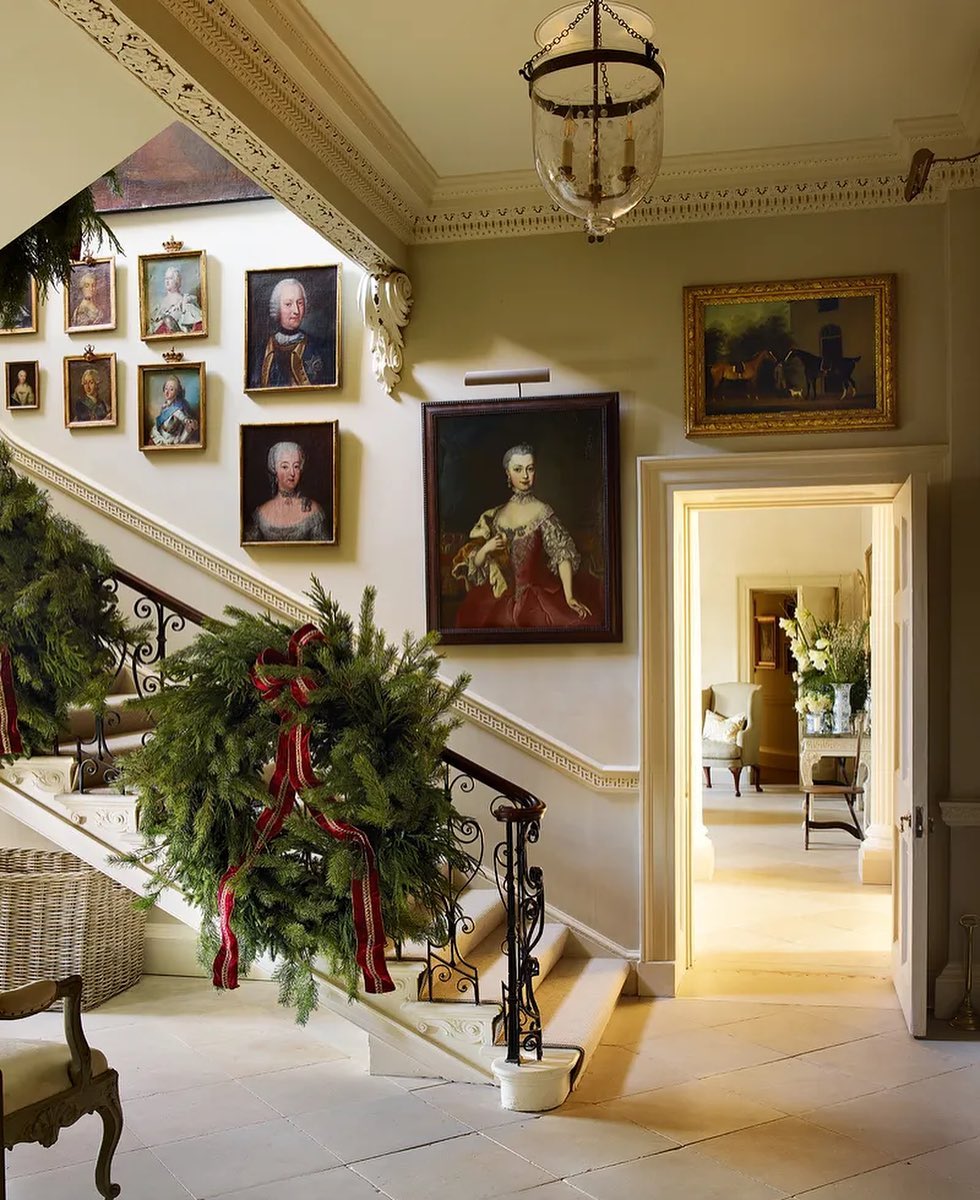 9. Twinkling Pinecones and Crimson Ribbons: a Festive Hallway Garland