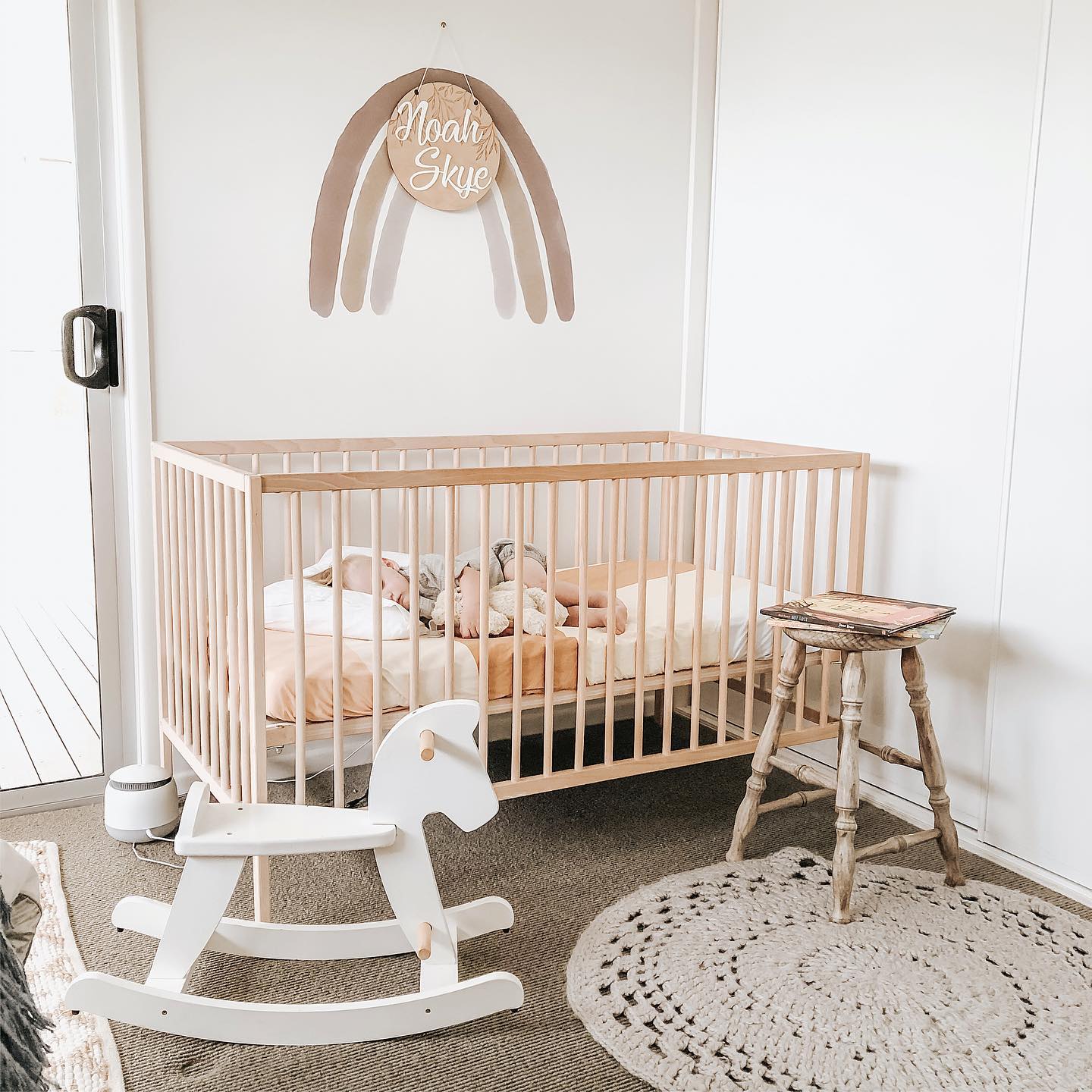 2. Soft Blush Tones and Geometric Shadows: a Crib In the Corner