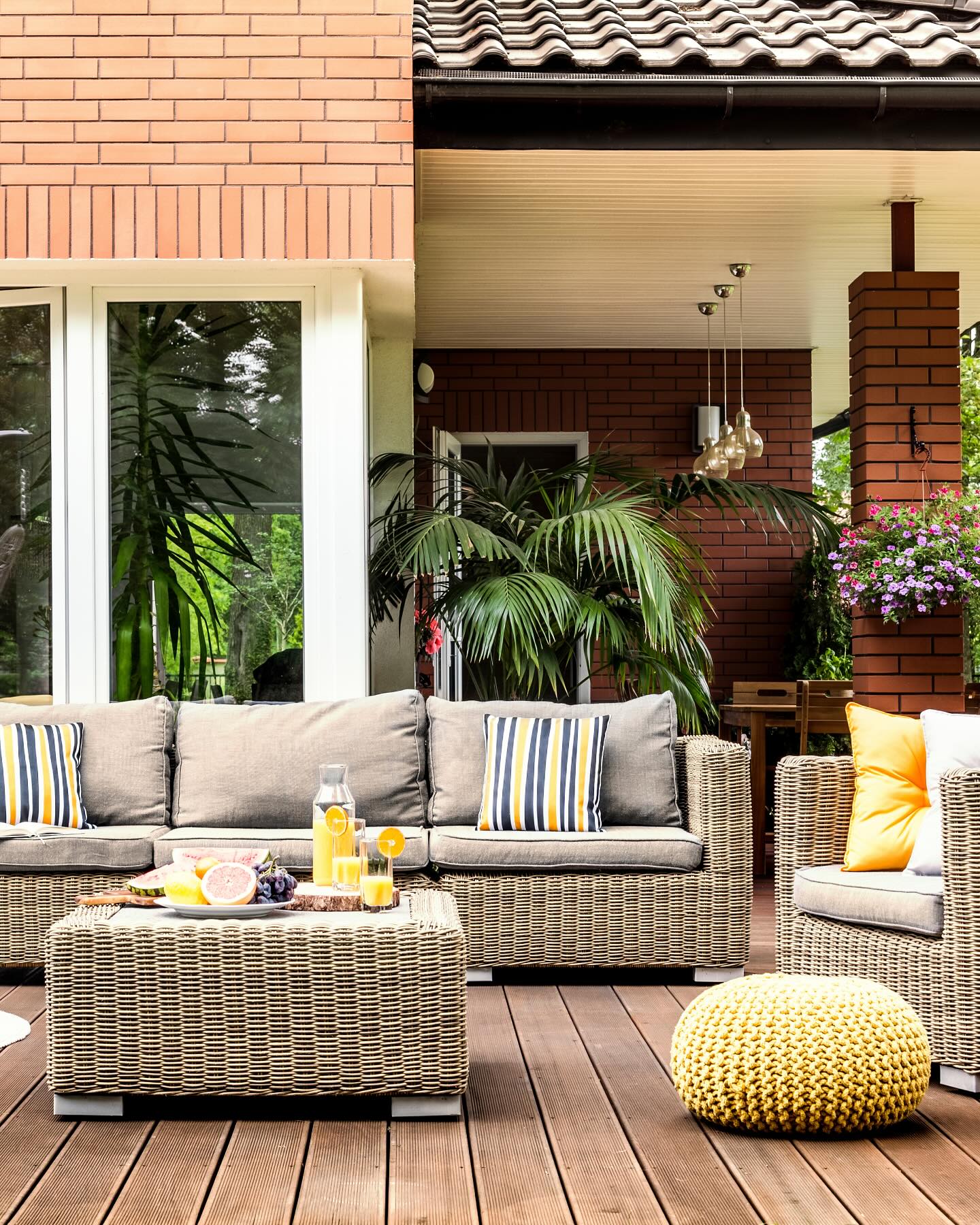13. Vibrant Fuchsia Cushions Contrasting Geometric Black Frame Patio Set
