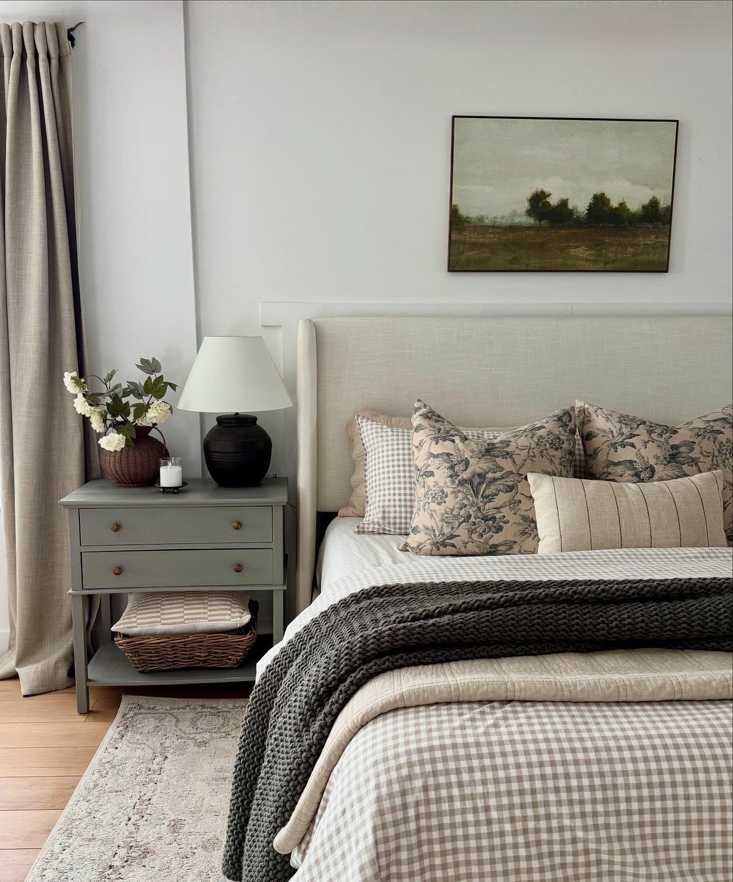 18. Soft Taupe Walls Embracing a Woven Rattan Bed Frame with Geometric White Bedding