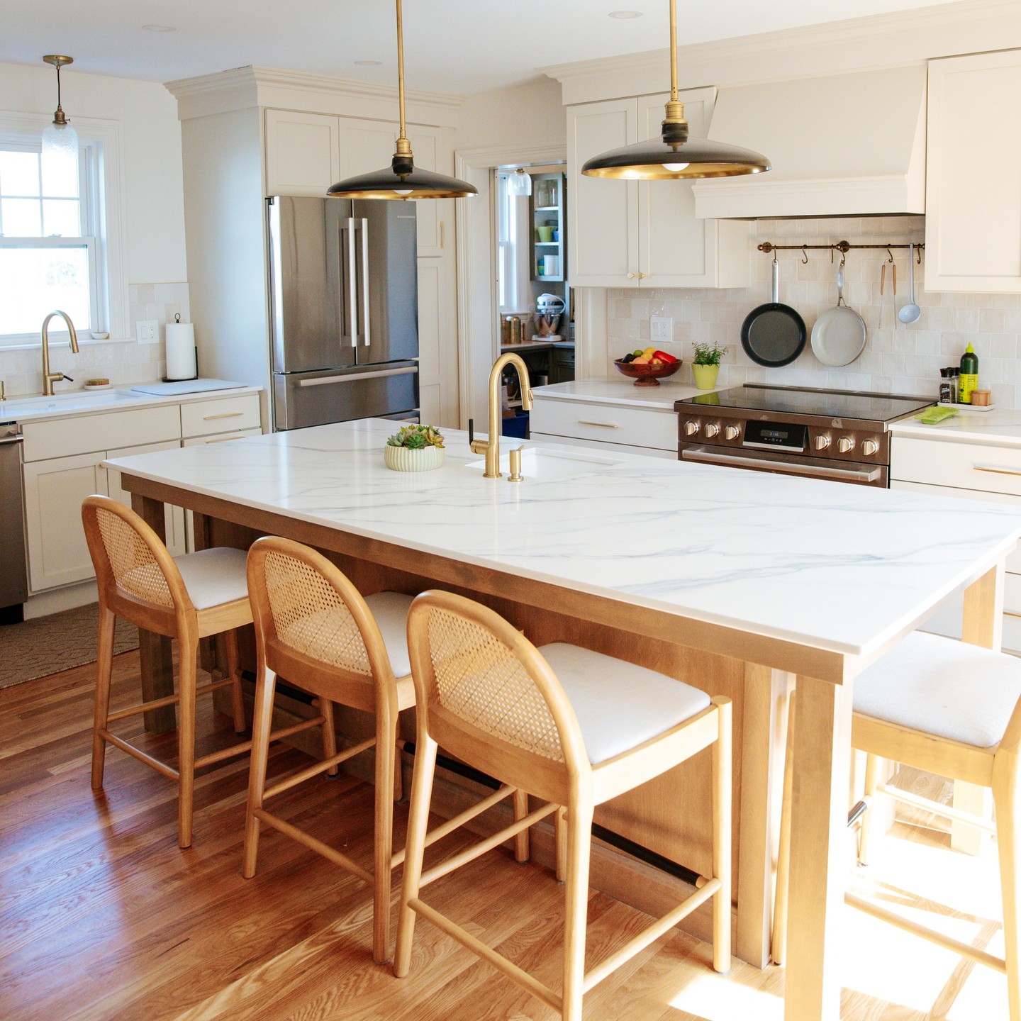 21. a Granite-topped Island with Industrial Pendant Lights and Butcher Block Accents