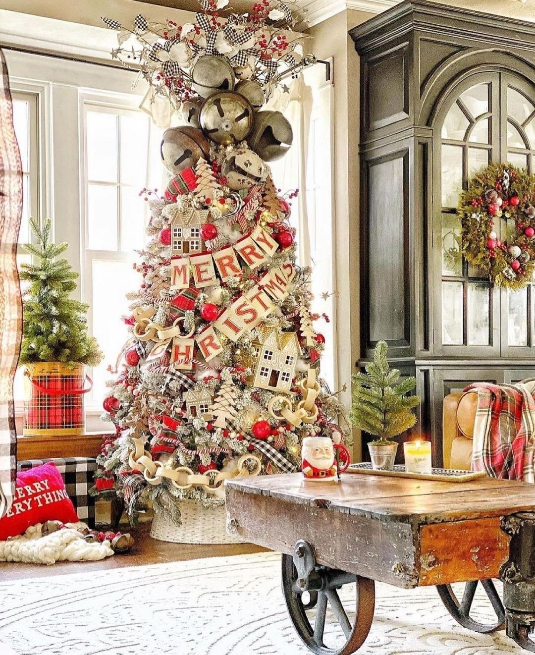 19. Crimson Ribbons and Snowy Pine Cones Wreath