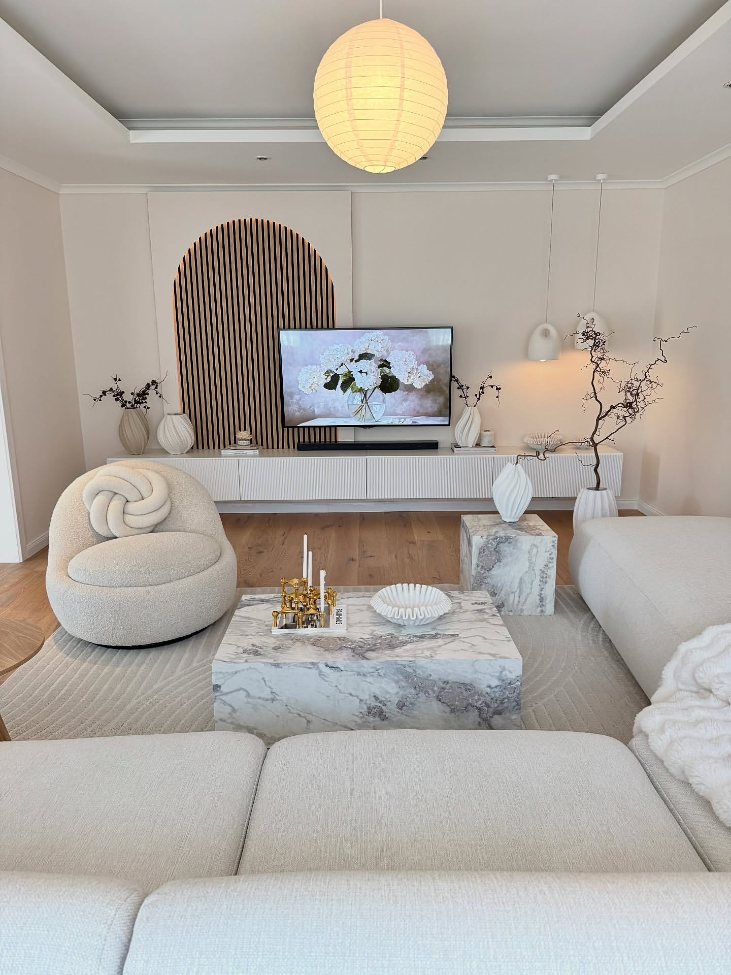 46. Crimson Velvet Sofa Anchors a Gallery Of Geometric Art In Sunlit Space