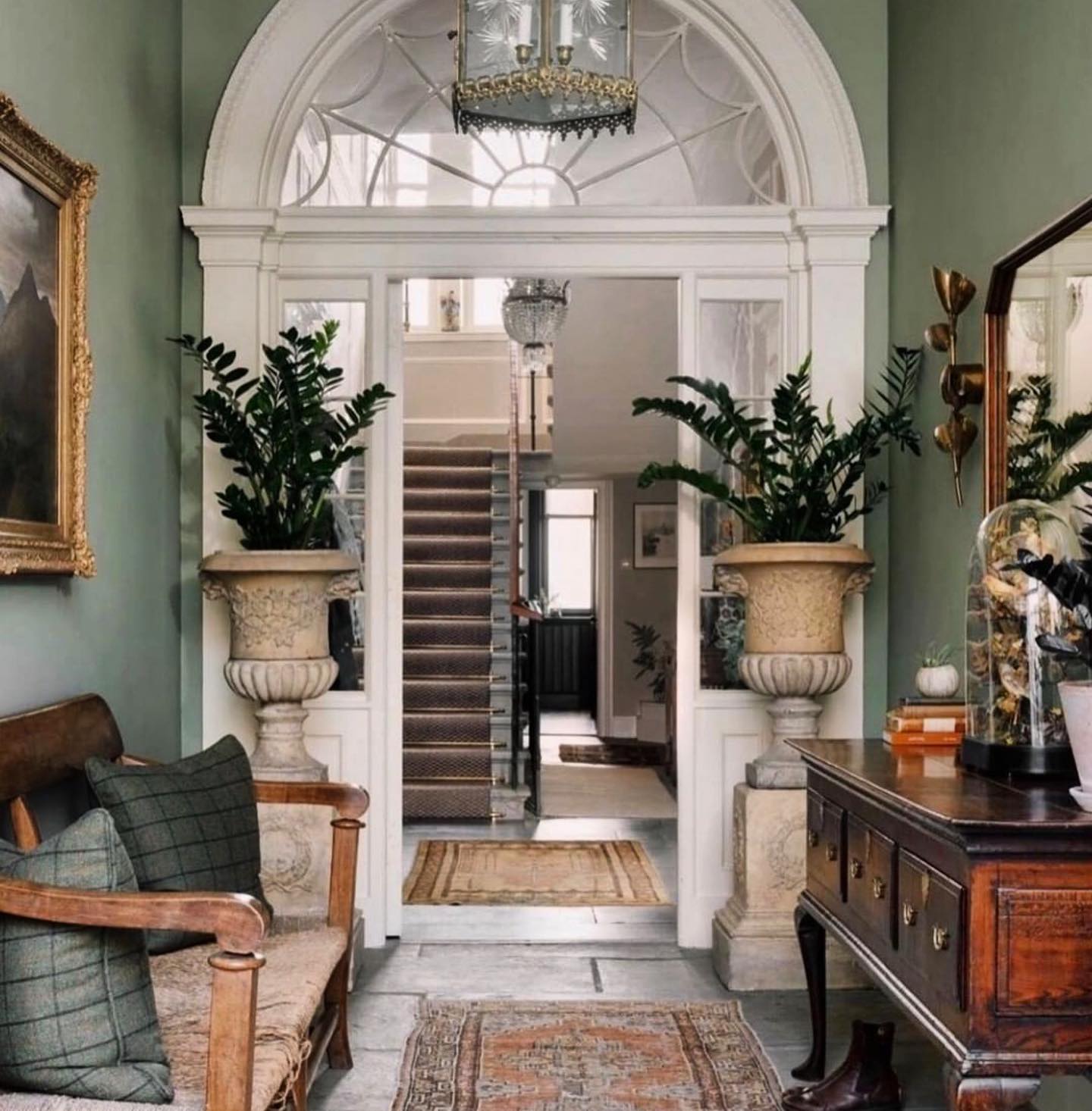 25. the Spiraling Staircase and Crimson Chandelier Entrance