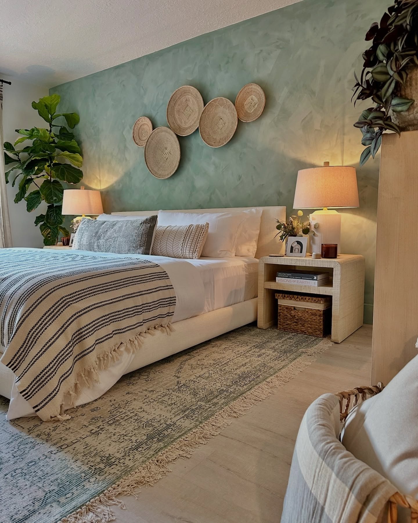 51. Lavender Dreamscape: Floral Wall Art Above a Cozy Bed Nook