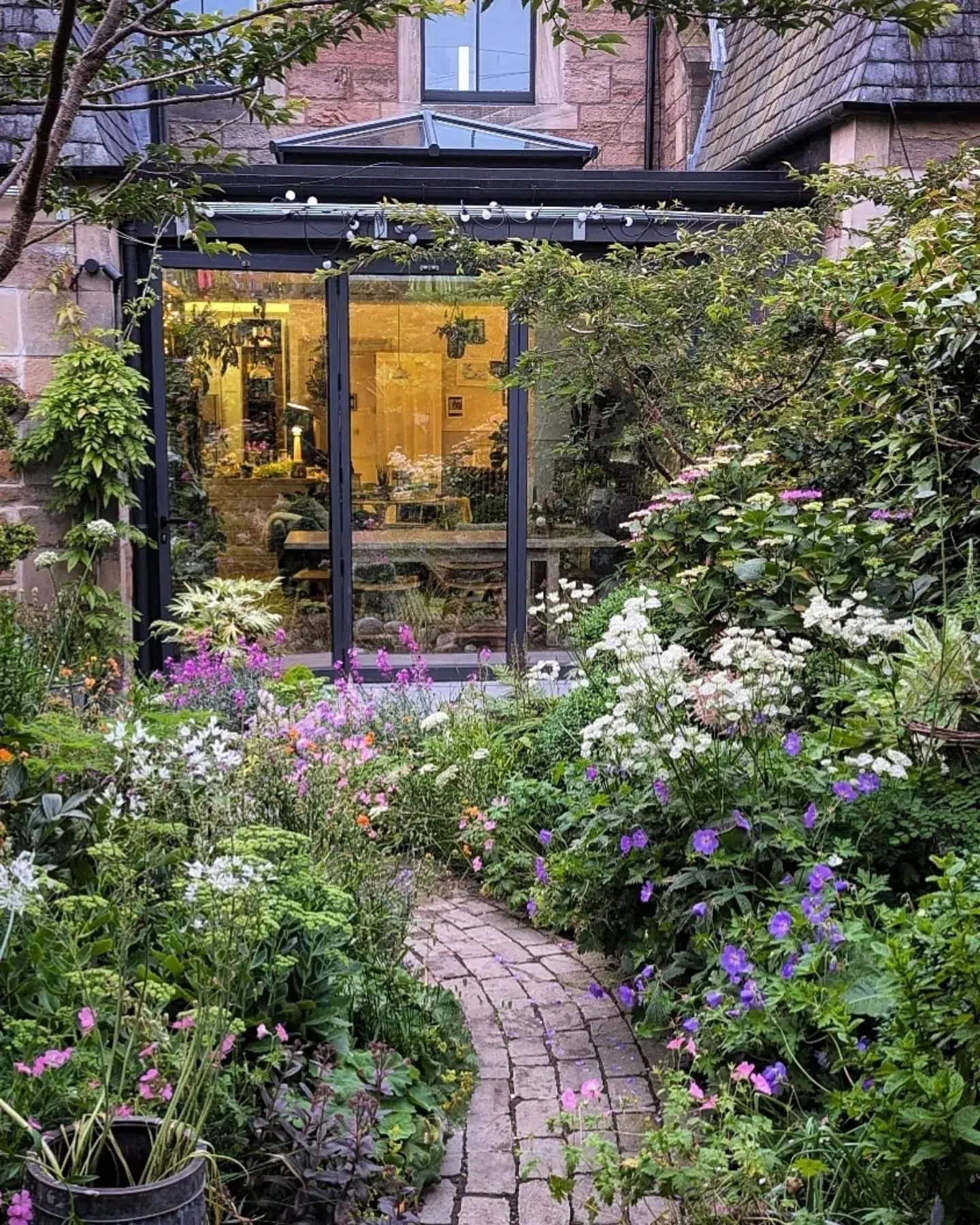 17. Tiny Teacup Garden with Mosaic Stepping Stones and Climbing Roses