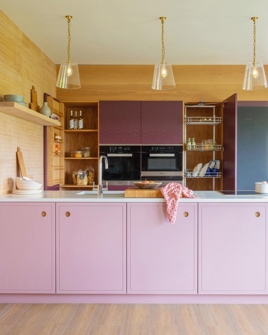 18. Raspberry Ripple Countertops with Mint Green Cabinets: a Whimsical Kitchen Fusion