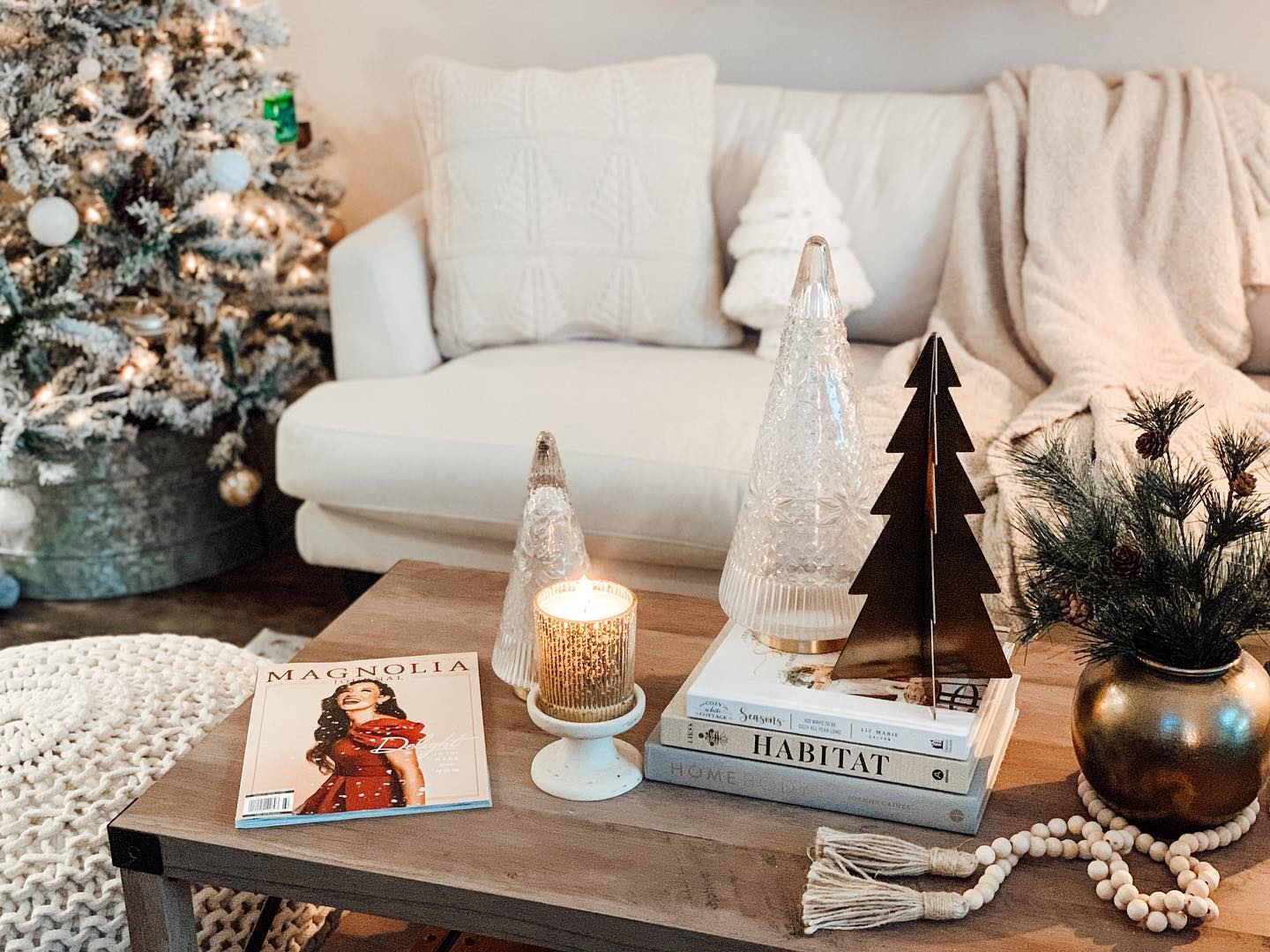 23. a Cinnamon Stick Garland Woven Through Pine Cones and Mini Ornaments on a Rustic Wooden Tray