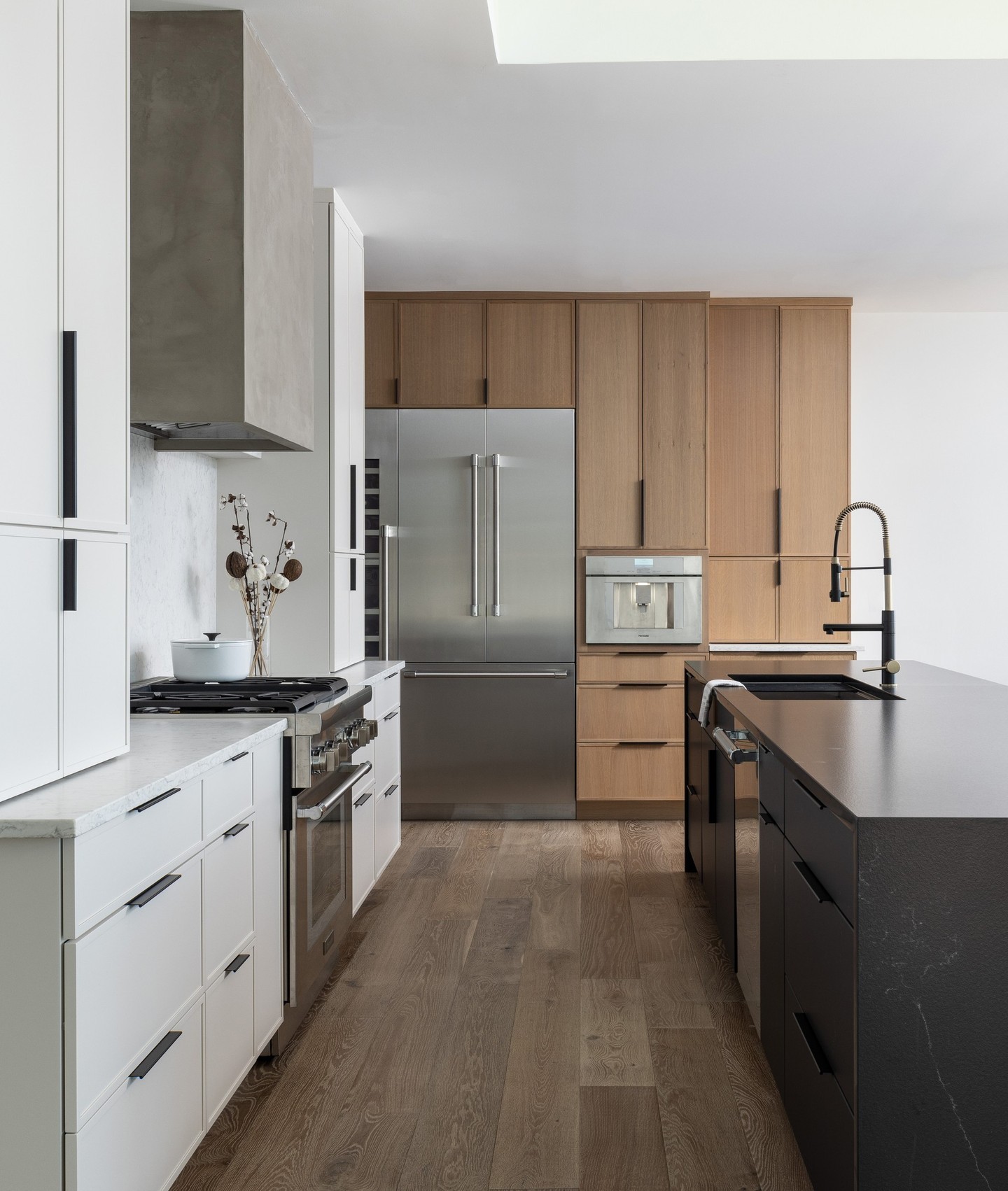 5. Sleek Midnight Espresso Cabinets with Geometric Brass Handles and Butcher Block Accents