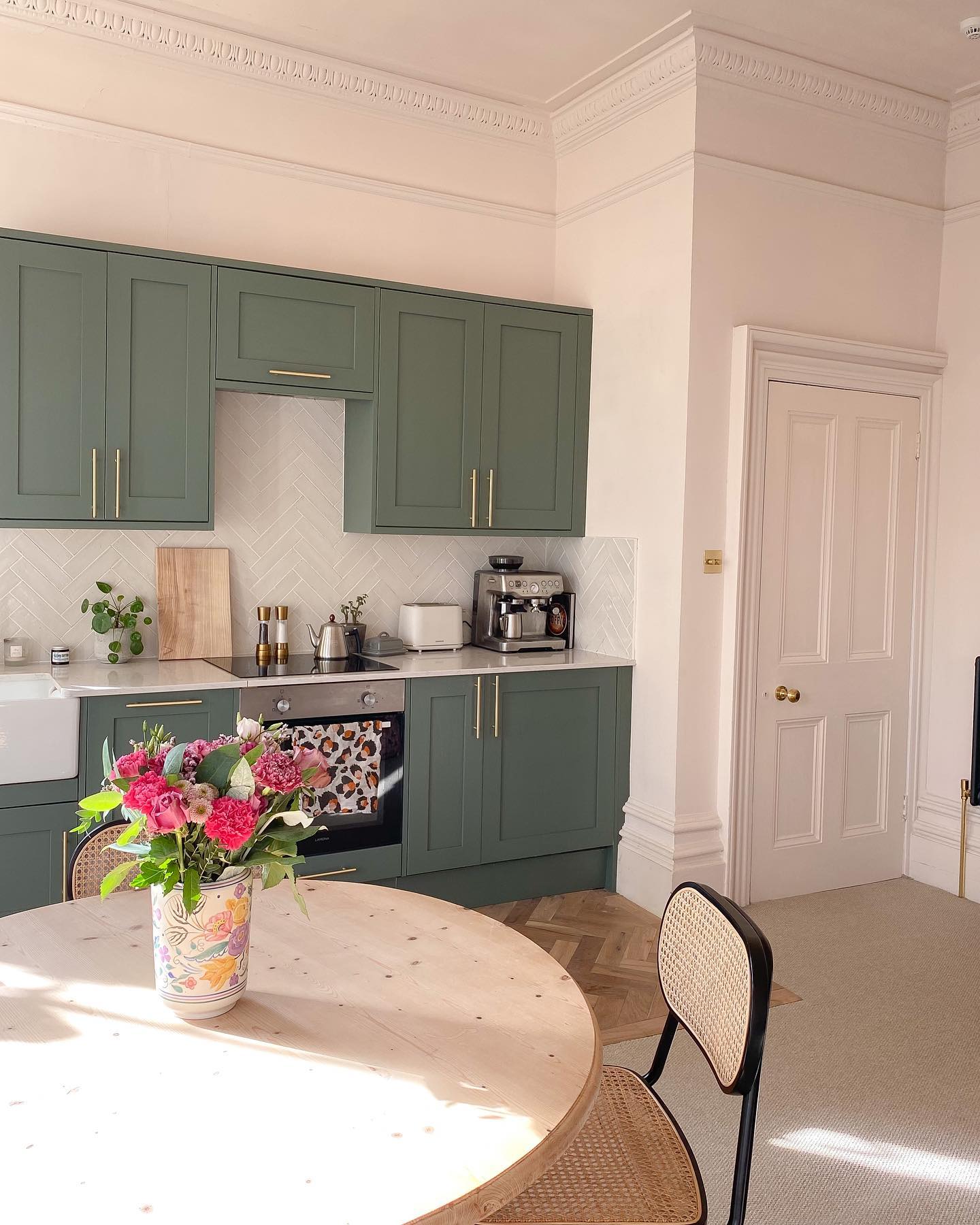 16. Verdant Vines and Vintage Knobs: a Kitchen Cabinet Transformation