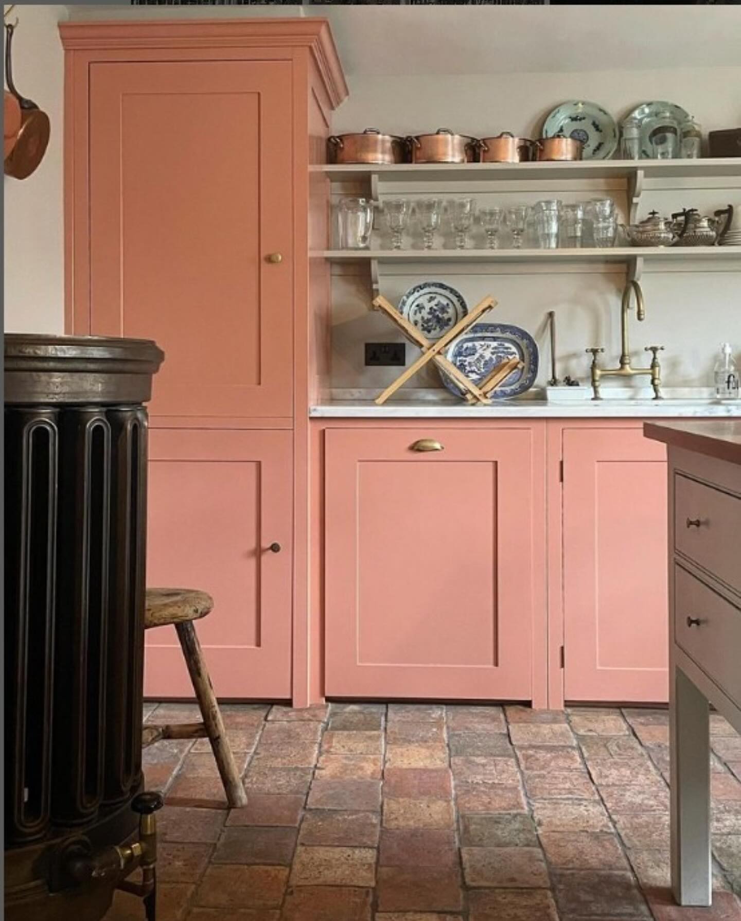 1. Regal Plum Cabinetry with Intricate Gold Molding and Vintage Glass Detailing