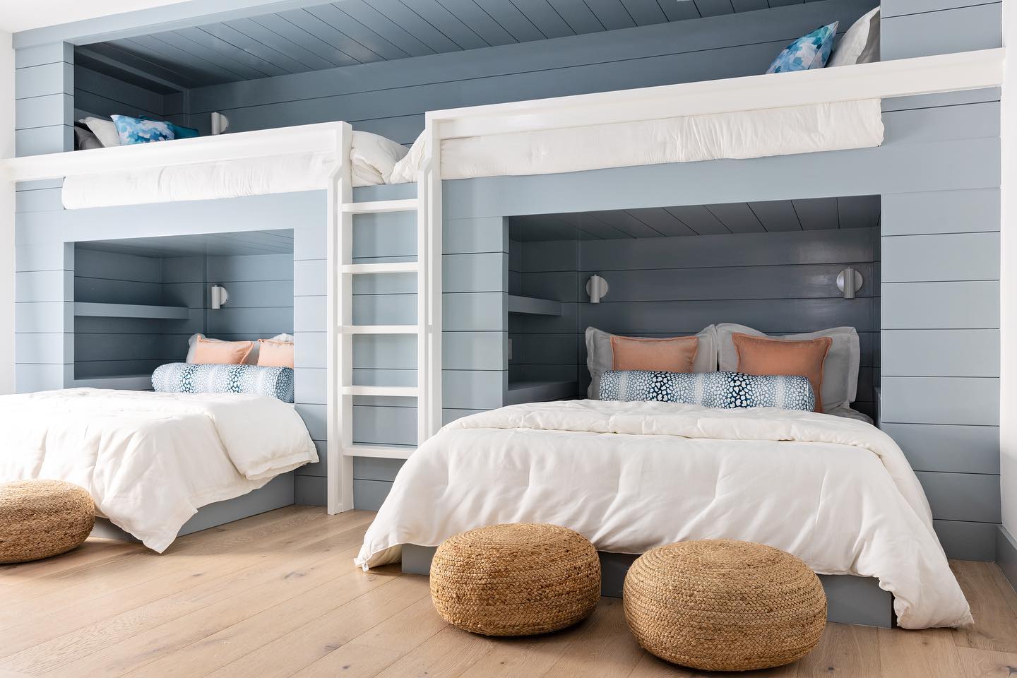 25. Coastal Retreat with a Nautical Twist: Rope Accents and Porthole Mirror In Soft Blues