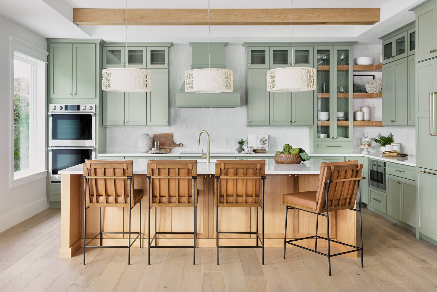 18. Aloe Vera Green Cabinets with Copper Accents and Geometric Tile Backsplash