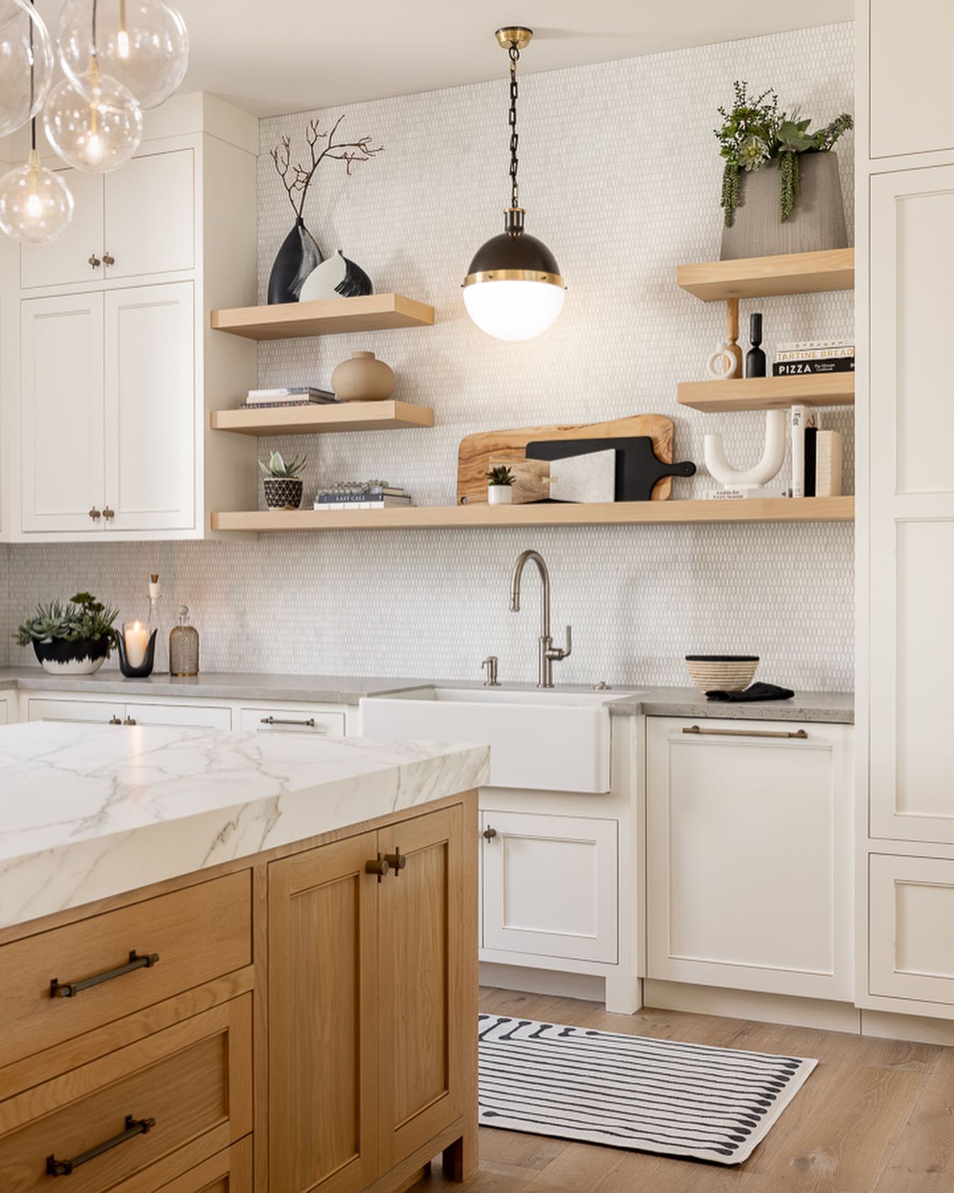 2. Cobalt Blue Herringbone with Brass Accents and Marble Slabs