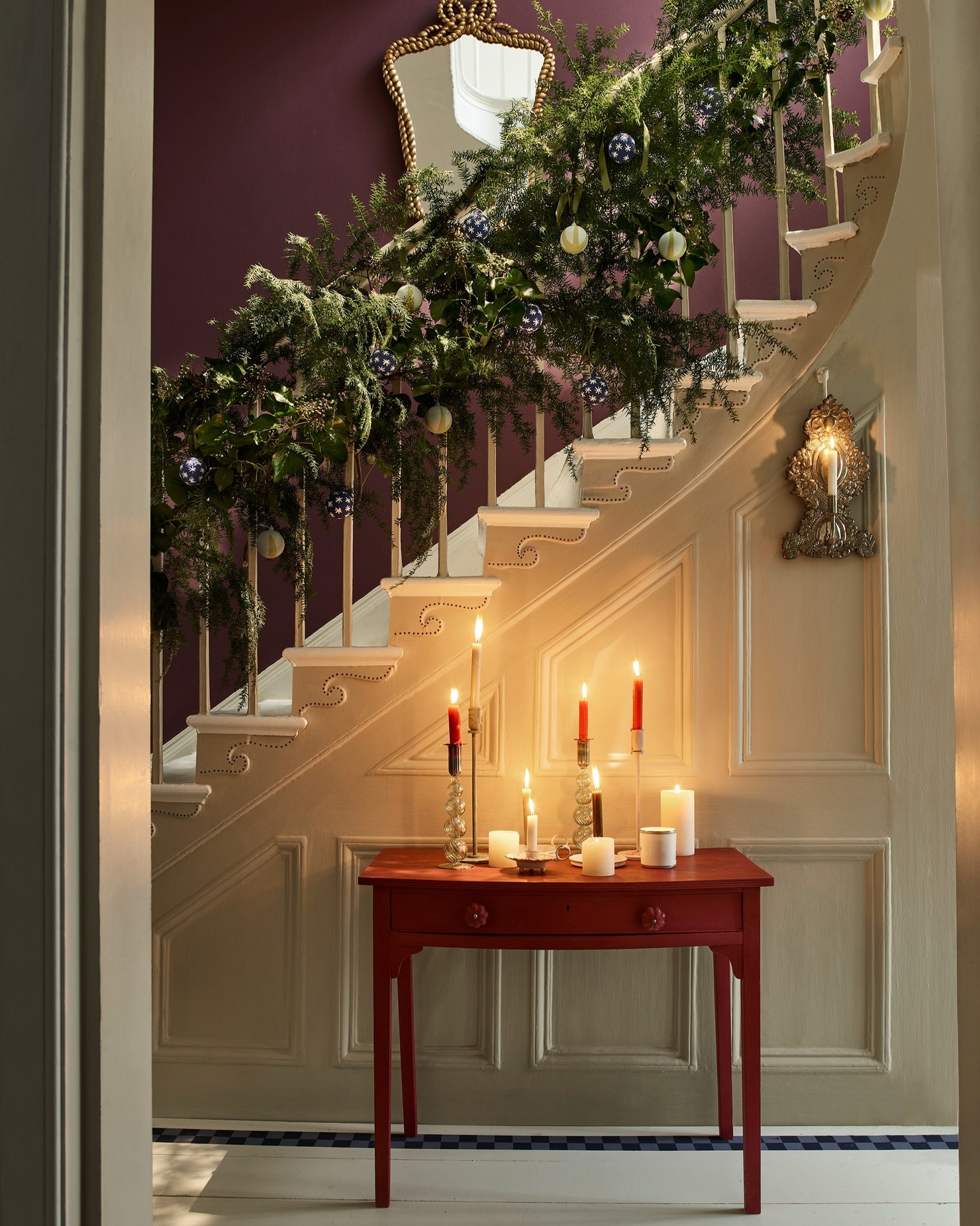 23. Crimson Ribbons and Golden Baubles: a Festive Hallway Garland