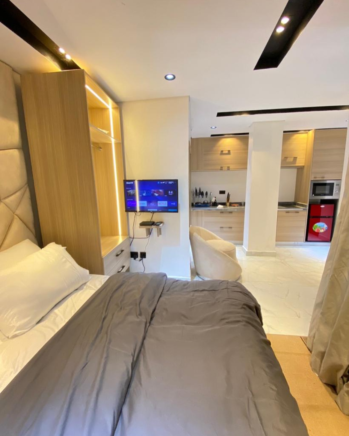 6. Compact Urban Oasis: a Murphy Bed with a Twist Of Teal and Geometric Patterns