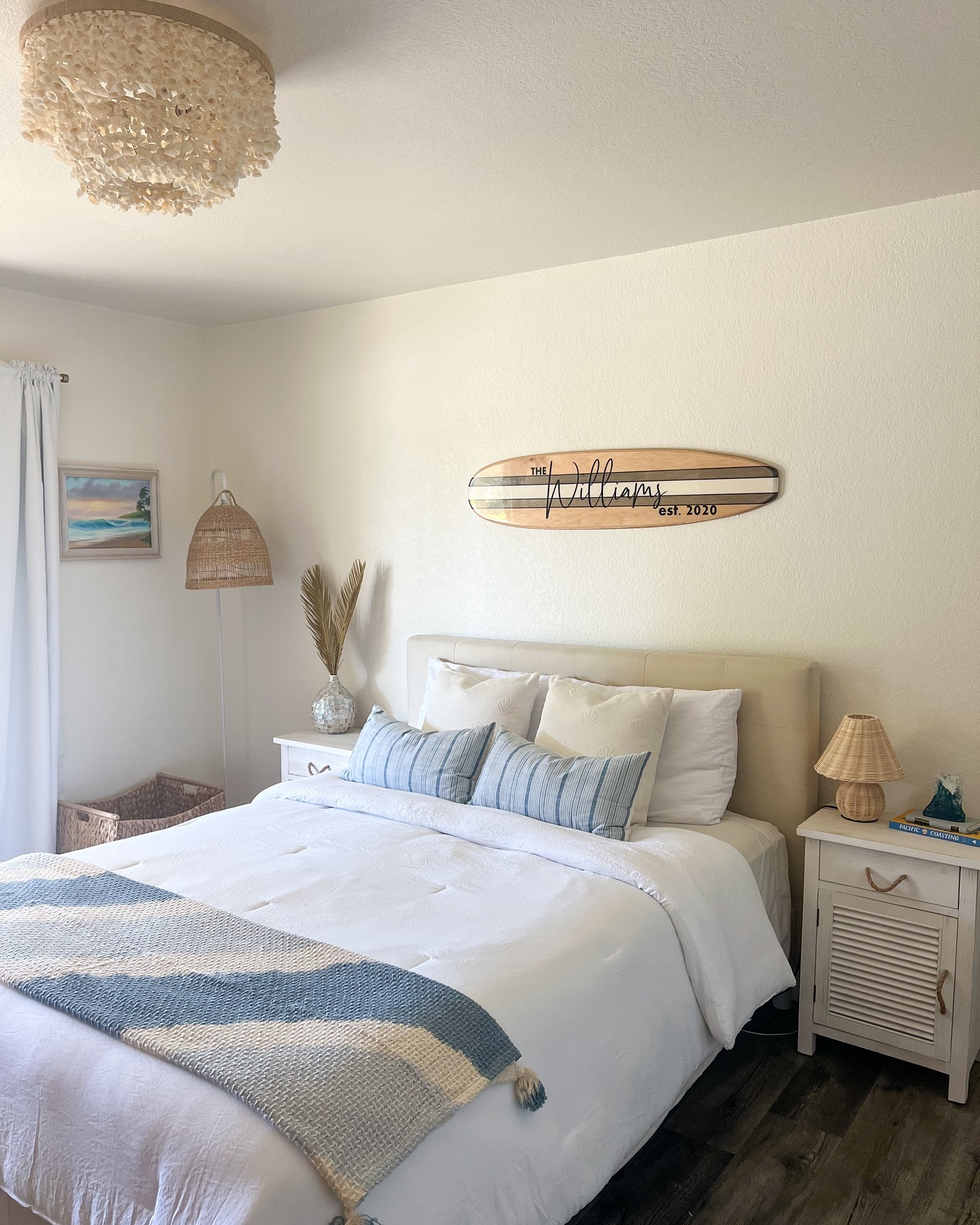 44. Coastal Bedroom with a Woven Wicker Ceiling Fan and Nautical Striped Bedding