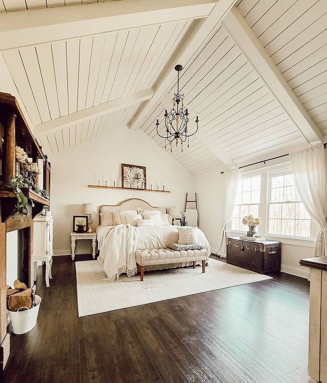 9. Farmhouse Charm with a Twist: Exposed Brick Wall and Vintage Bed Frame