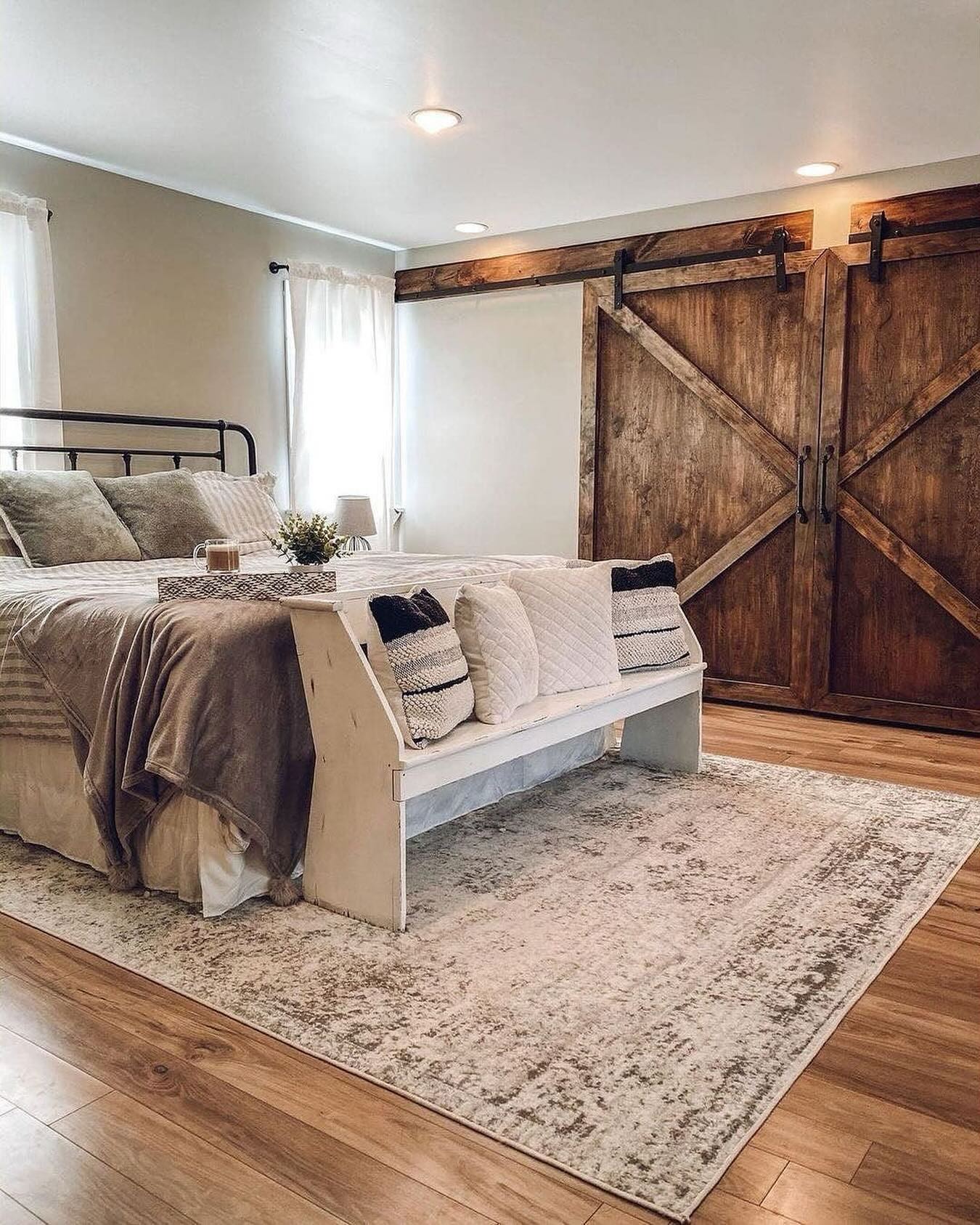4. Distressed Wood Accents Meet Vintage Lace Bedding In Cozy Farmhouse Retreat