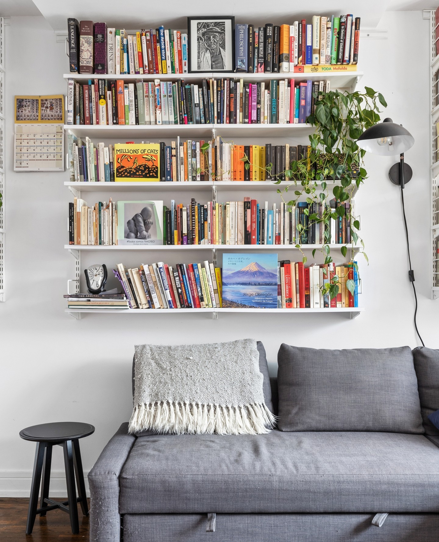 32. the Geometric Orchid and Gold Frame Symmetry Above the Couch