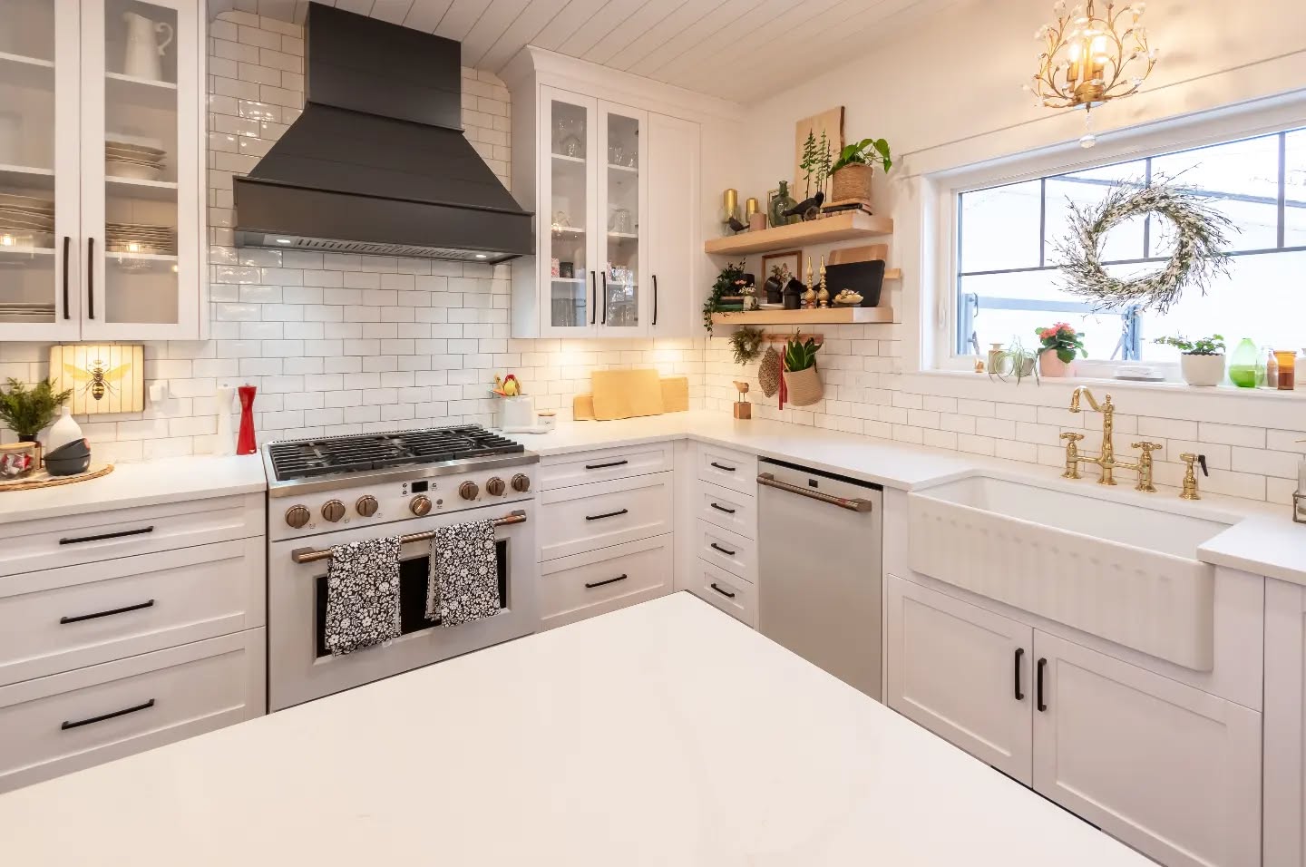 26. Sunlit Serenity: a Farmhouse Kitchen with a Weathered Wood Island and Vintage Scale