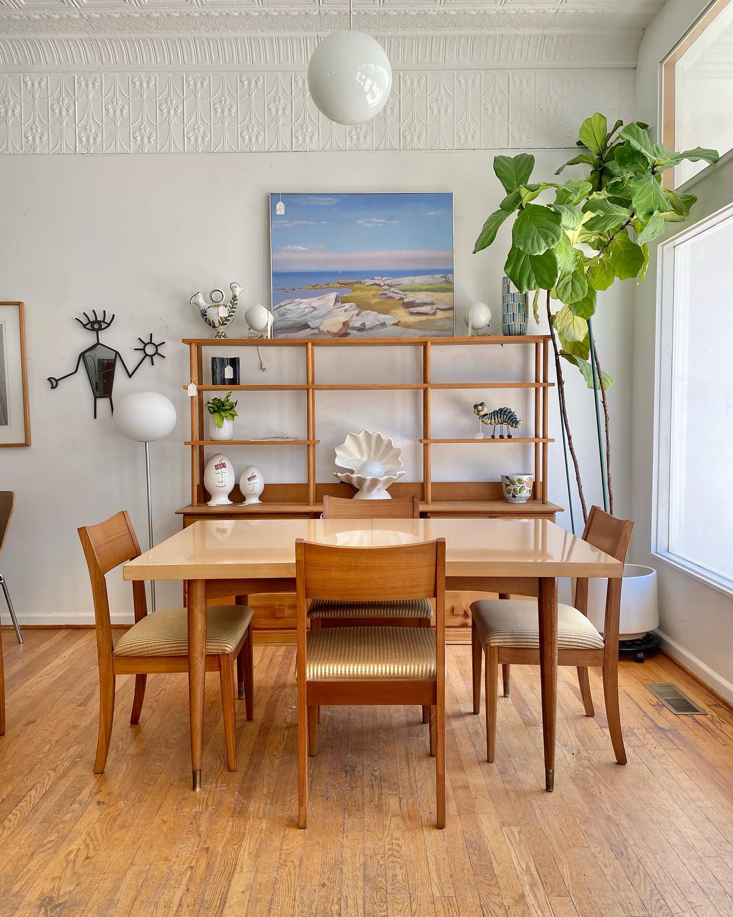 13. Mid-century Minimalist with Tapered Legs and Geometric Brass Inlay