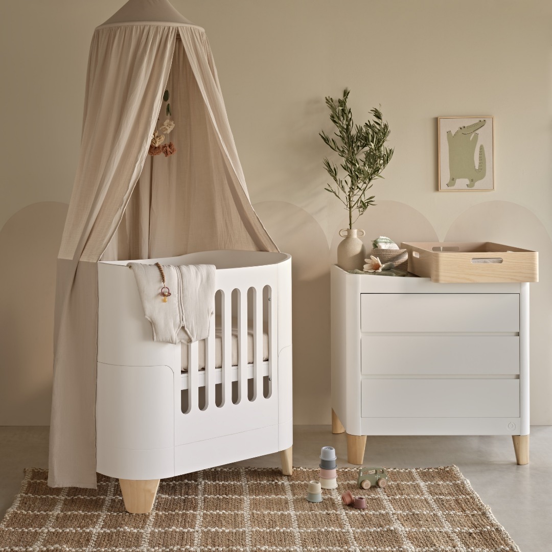 10. Soft Whisper Of Mint: a Nursery with Pastel Green Accents and Geometric Wall Art