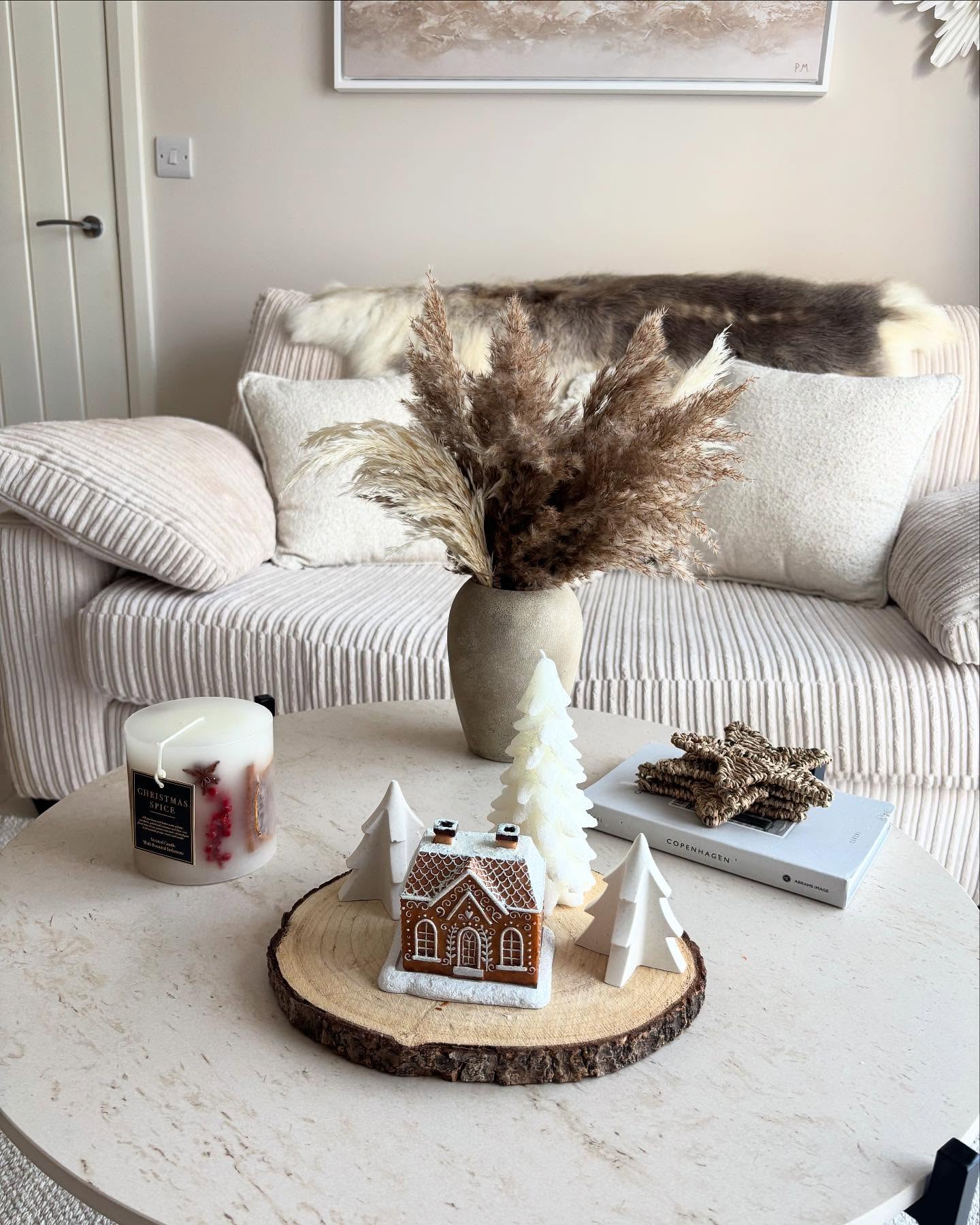 15. a Symphony Of Pinecones and Crimson Ribbons on a Frosted Glass Coffee Table