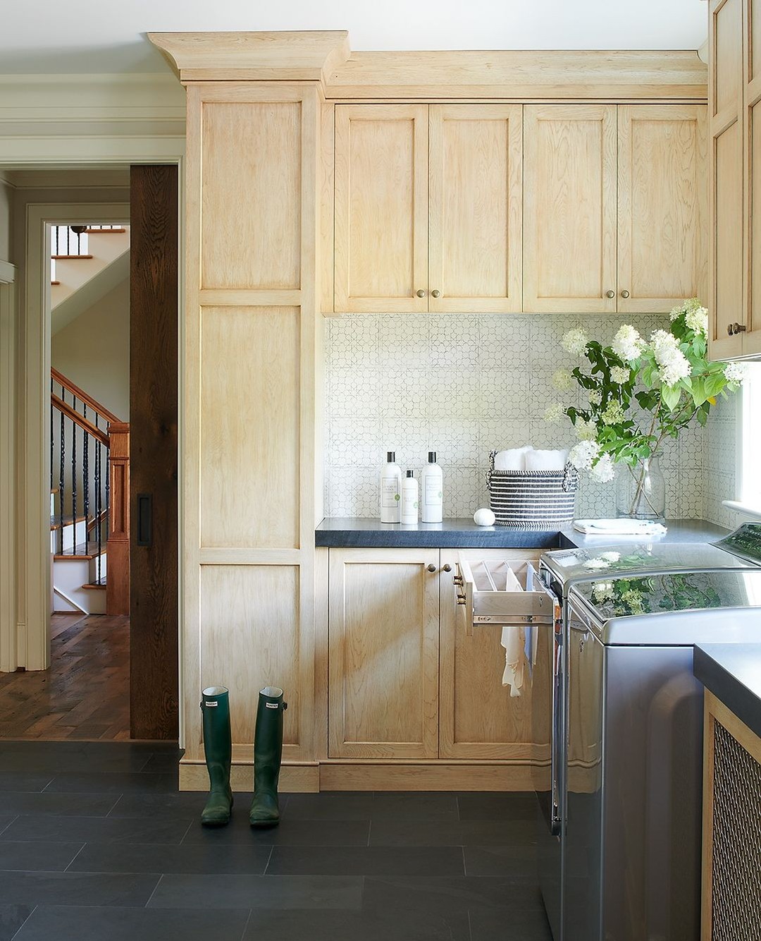 5. the Sunlit Corner with a Hint Of Vintage Charm: a White Cabinet with Brass Hardware and Shadowed Nooks