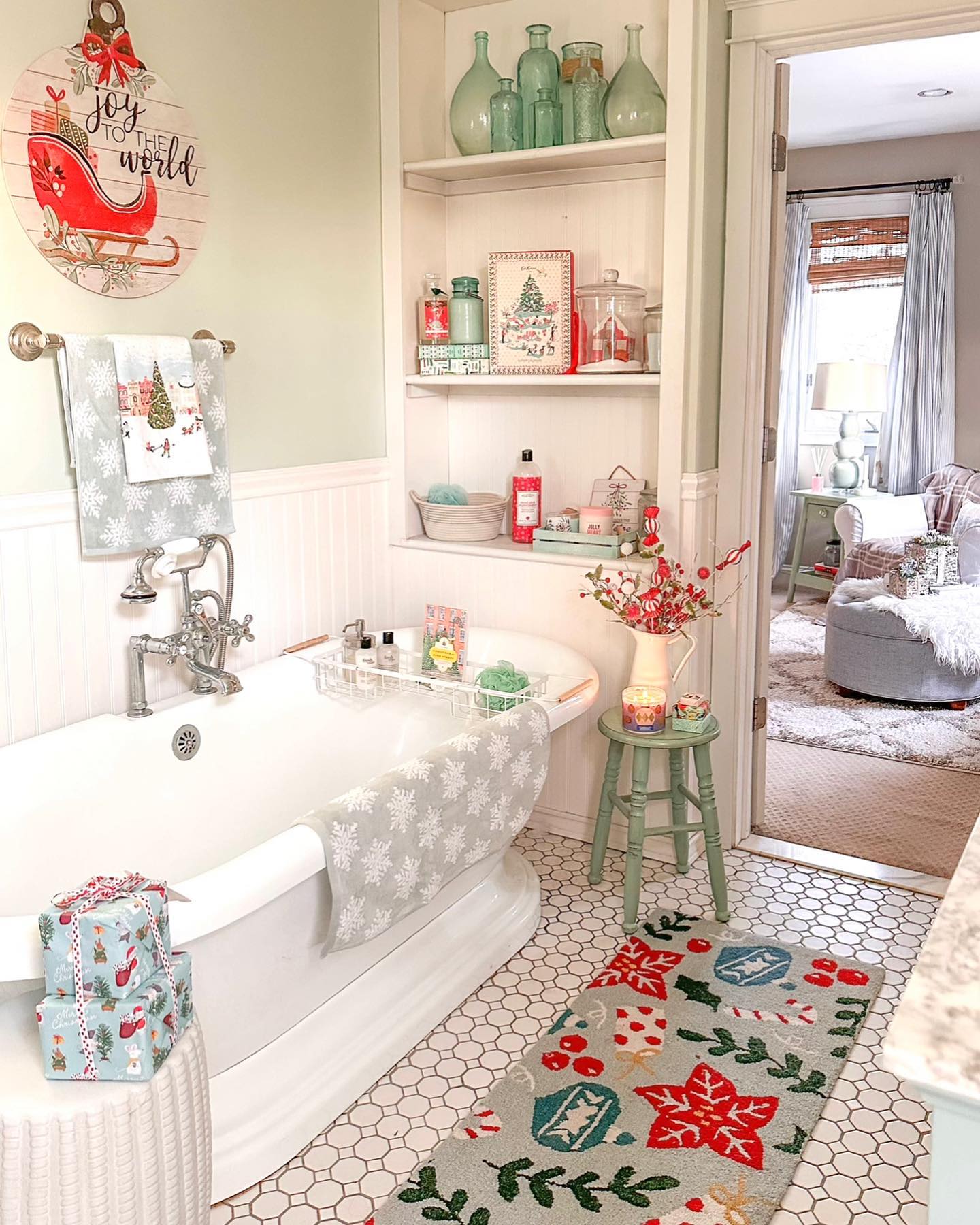 14. a Reindeer Towel and Pinecone Soap Ensemble on a White Sink Ledge