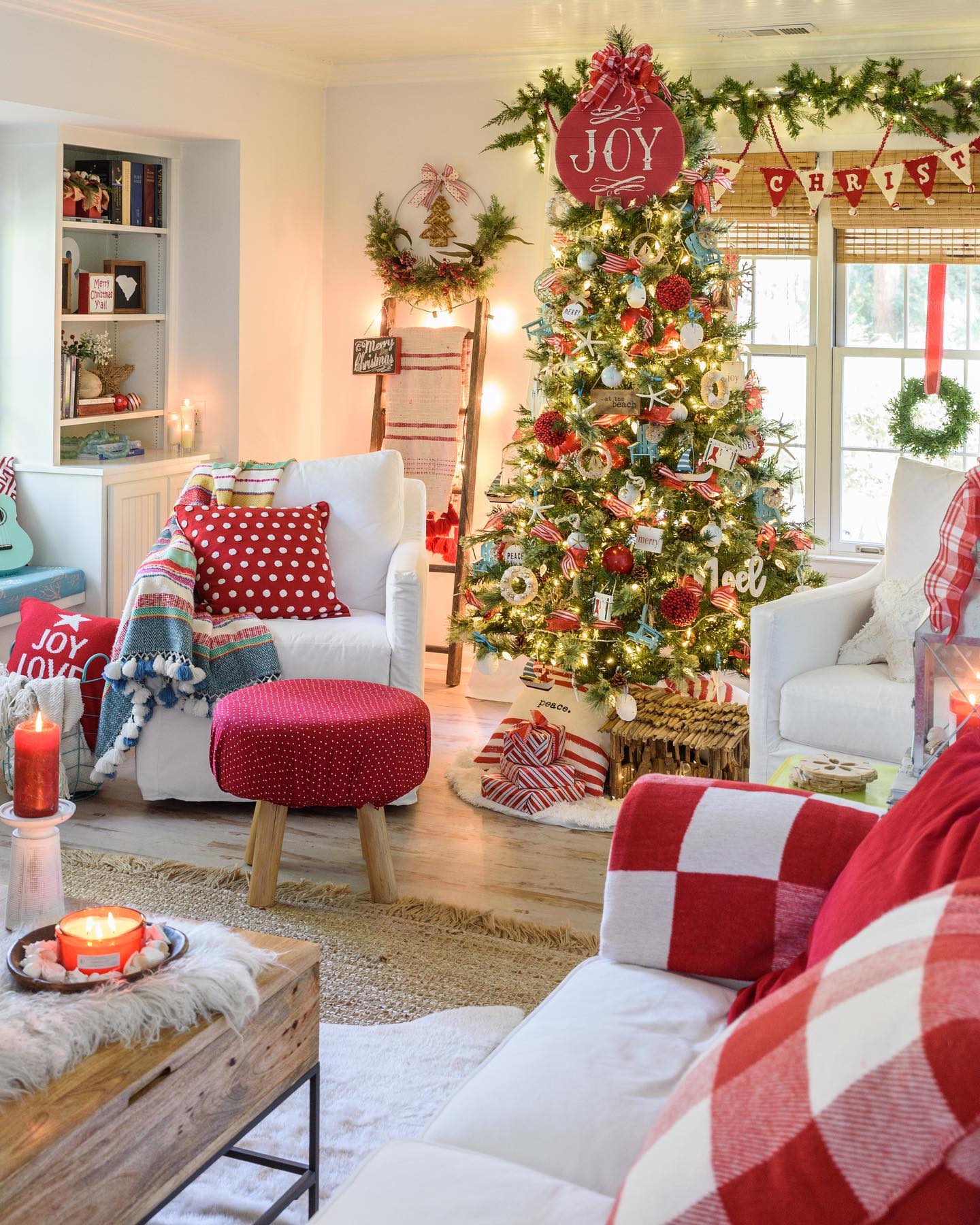 18. Crimson Ribbons and Snowy Pine Cones Wreath