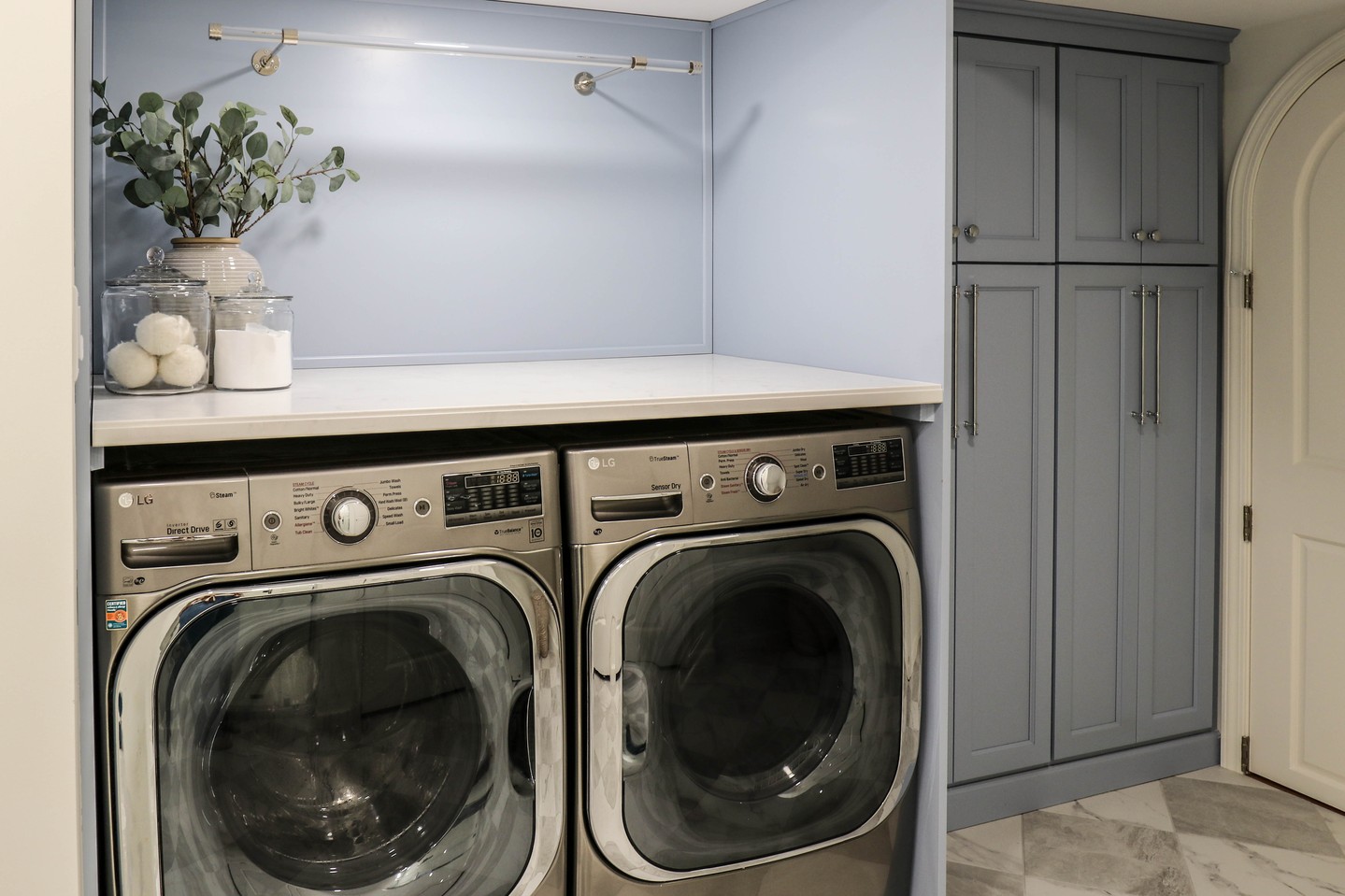 2. Vibrant Turquoise Doors Meet Industrial Chic with Exposed Piping