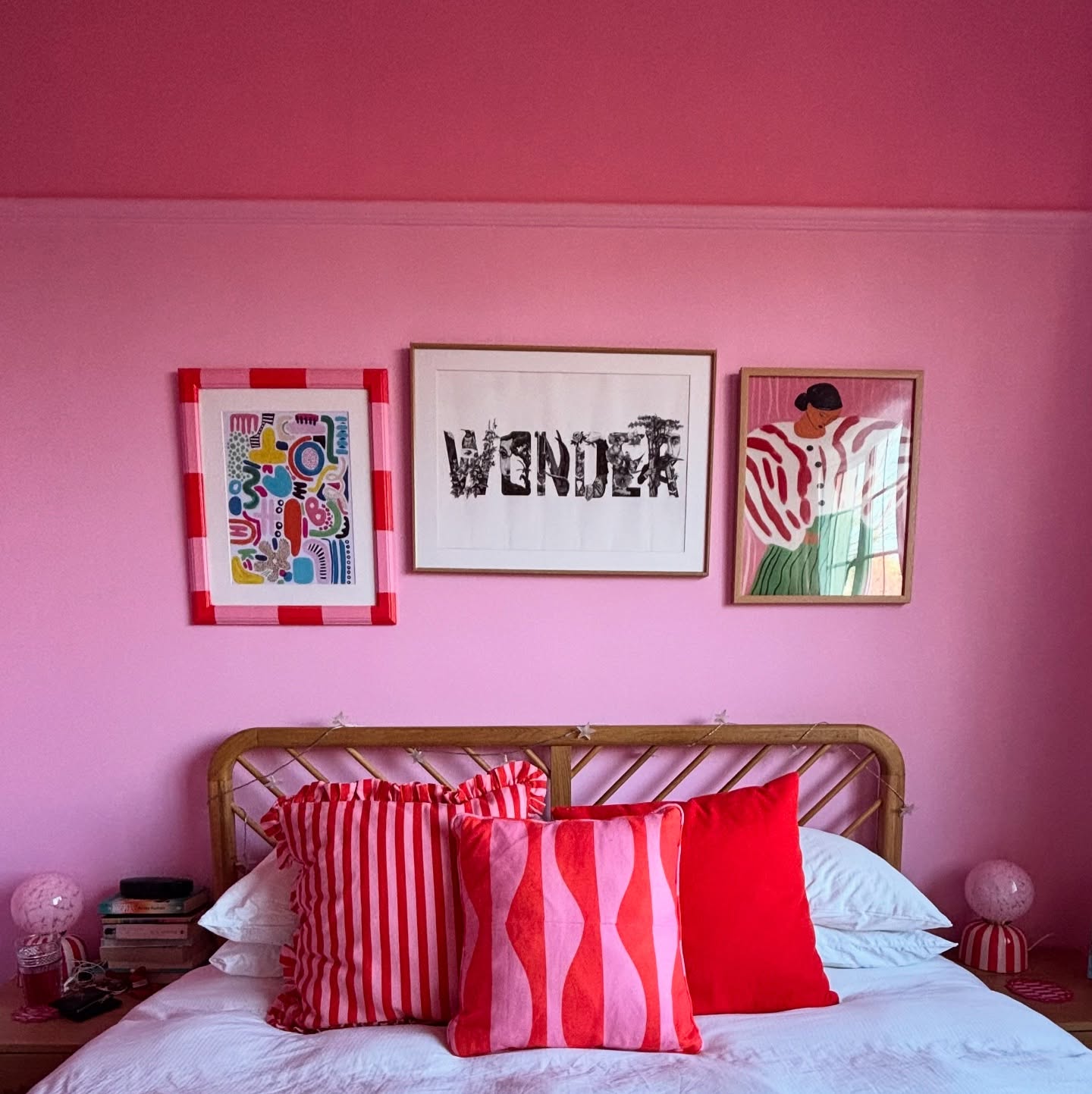 39. a Canopy Of Soft Pink Tulle Over Vintage White Iron Bed
