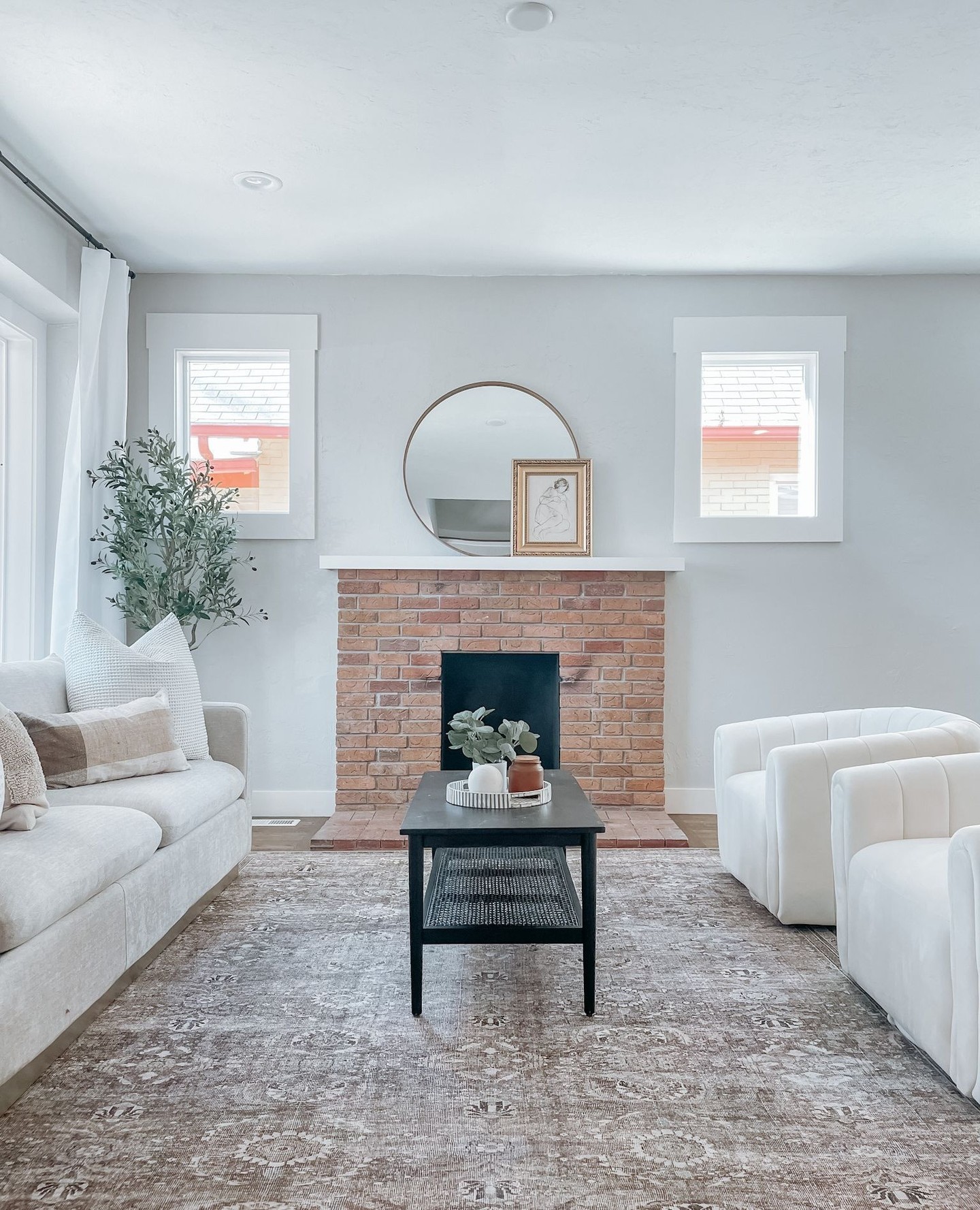 48. a Velvet Armchair with Tasseled Throw Amidst Geometric Wall Art