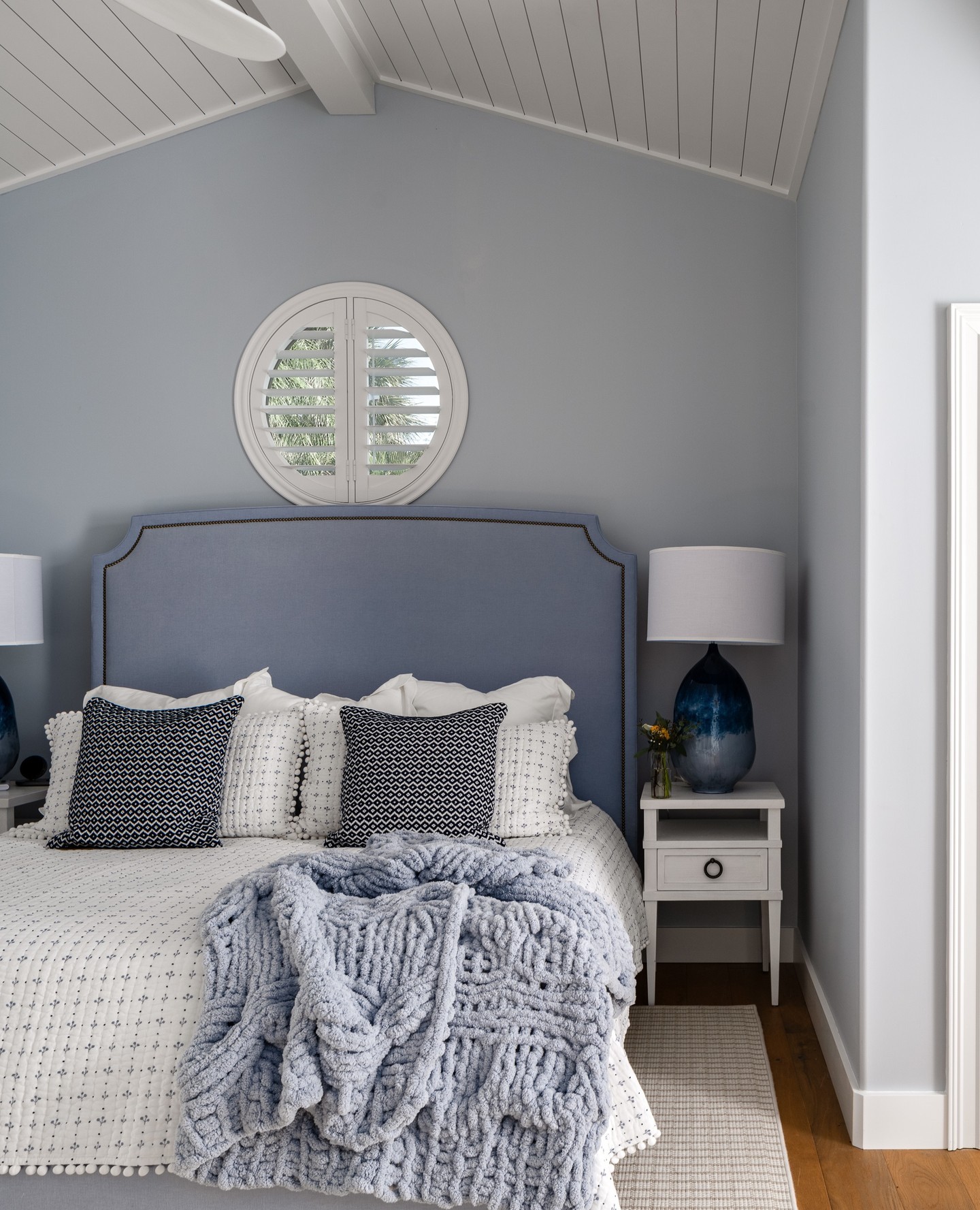 6. Coastal Haven with a Canopy Of Dreams: Woven Rattan and White Linens