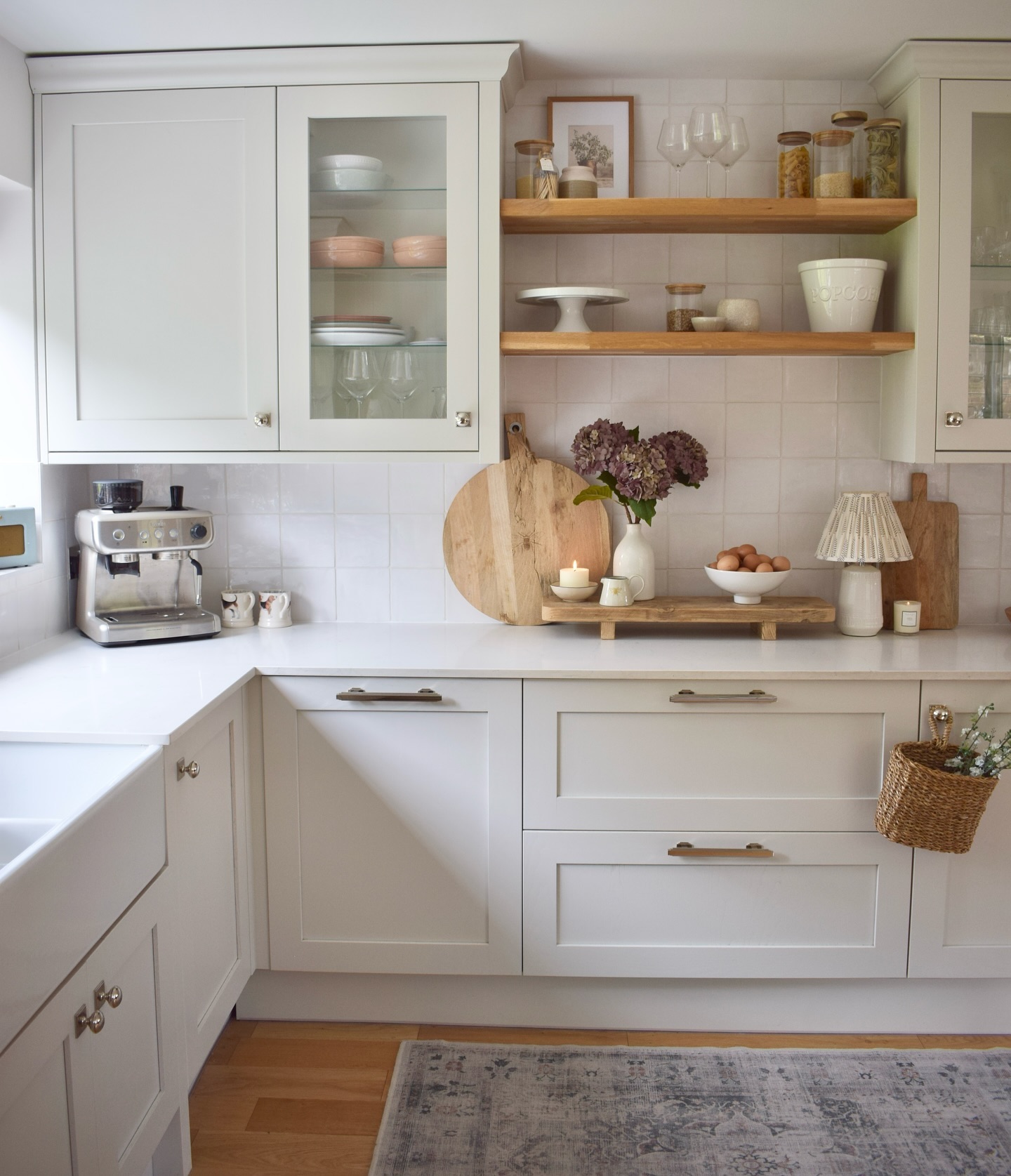 20. White Cabinets with Butcher Block Countertops and Brass Hardware Accents