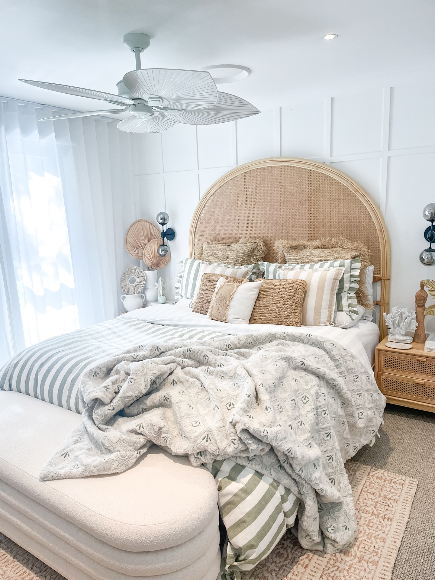 46. Coastal Serenity with a Teal Accent Wall and Rattan Pendant Light