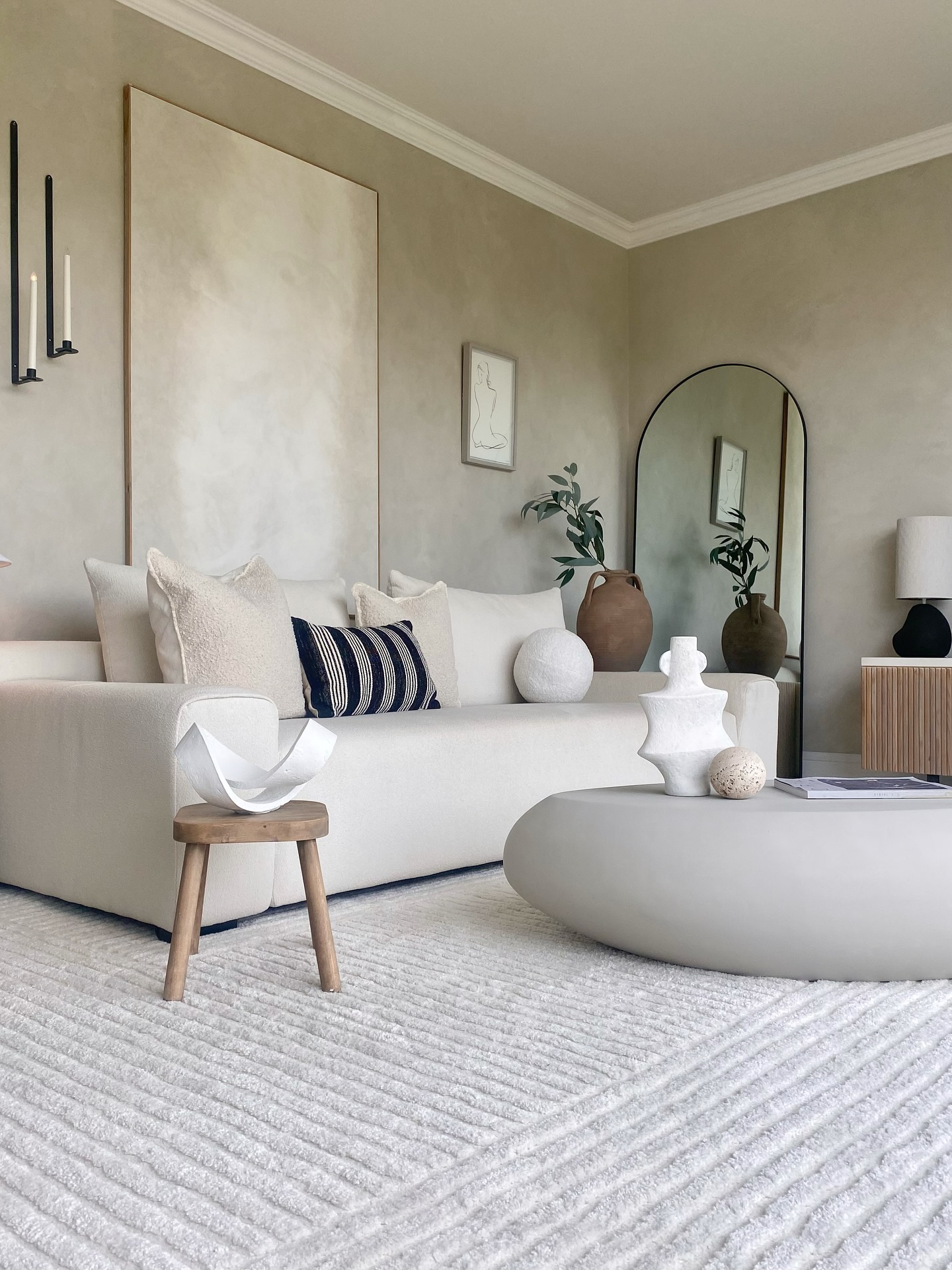 1. the Soft Taupe Sofa with Geometric Scatter Cushions and Brass Orb Accents