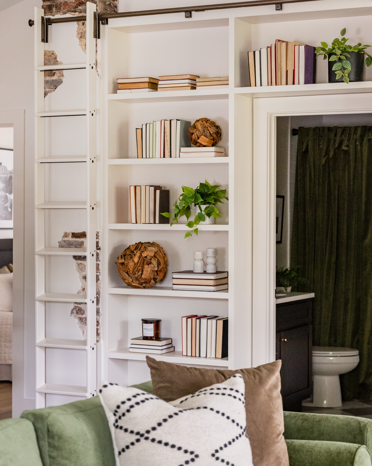 4. Built-in Shelves with Geometric Glass Accents and Integrated Fireplace