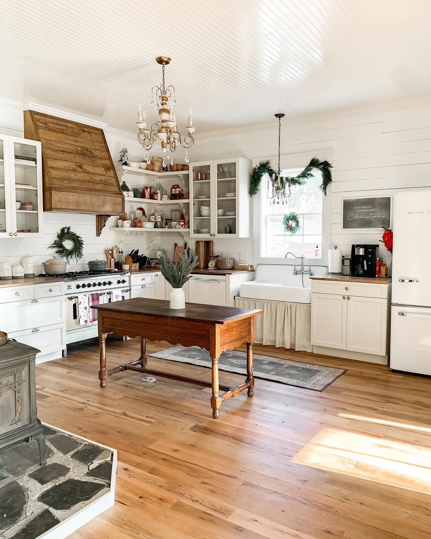 11. Vintage Bicycle Wheel Chandelier Over Distressed White Island In Farmhouse Kitchen
