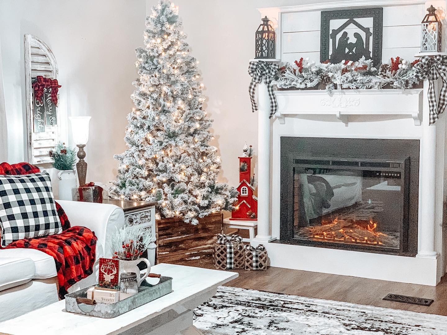 20. a Snowy Pine Cone and Ribbon Garland Draped Over a Black Iron Archway
