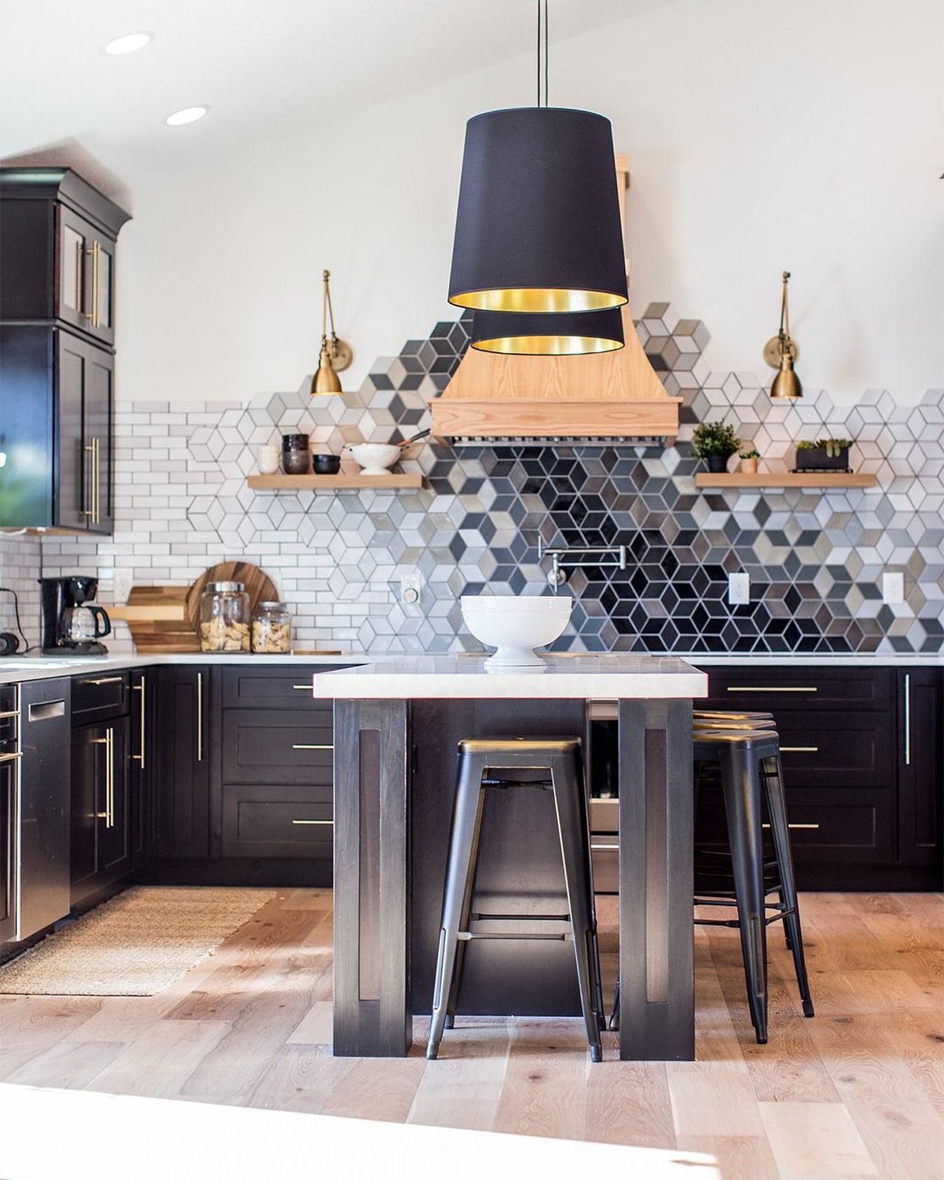 40. Glossy Black Hexagons and Brass Accents: a Modern Kitchen Transformation